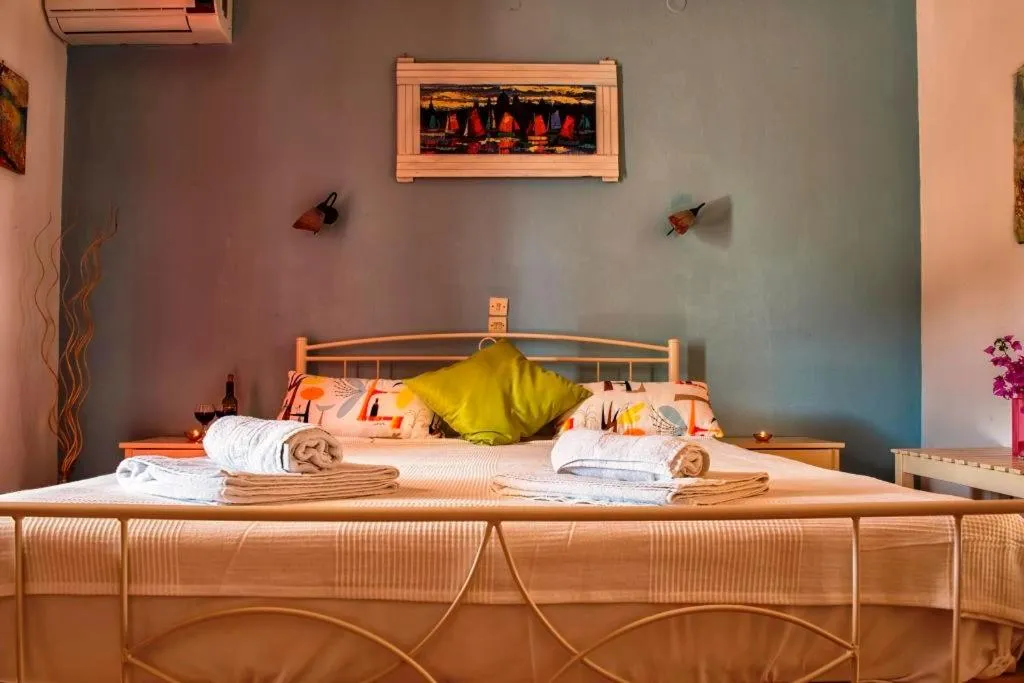 Bed in Elli Beach Apartments and Studios