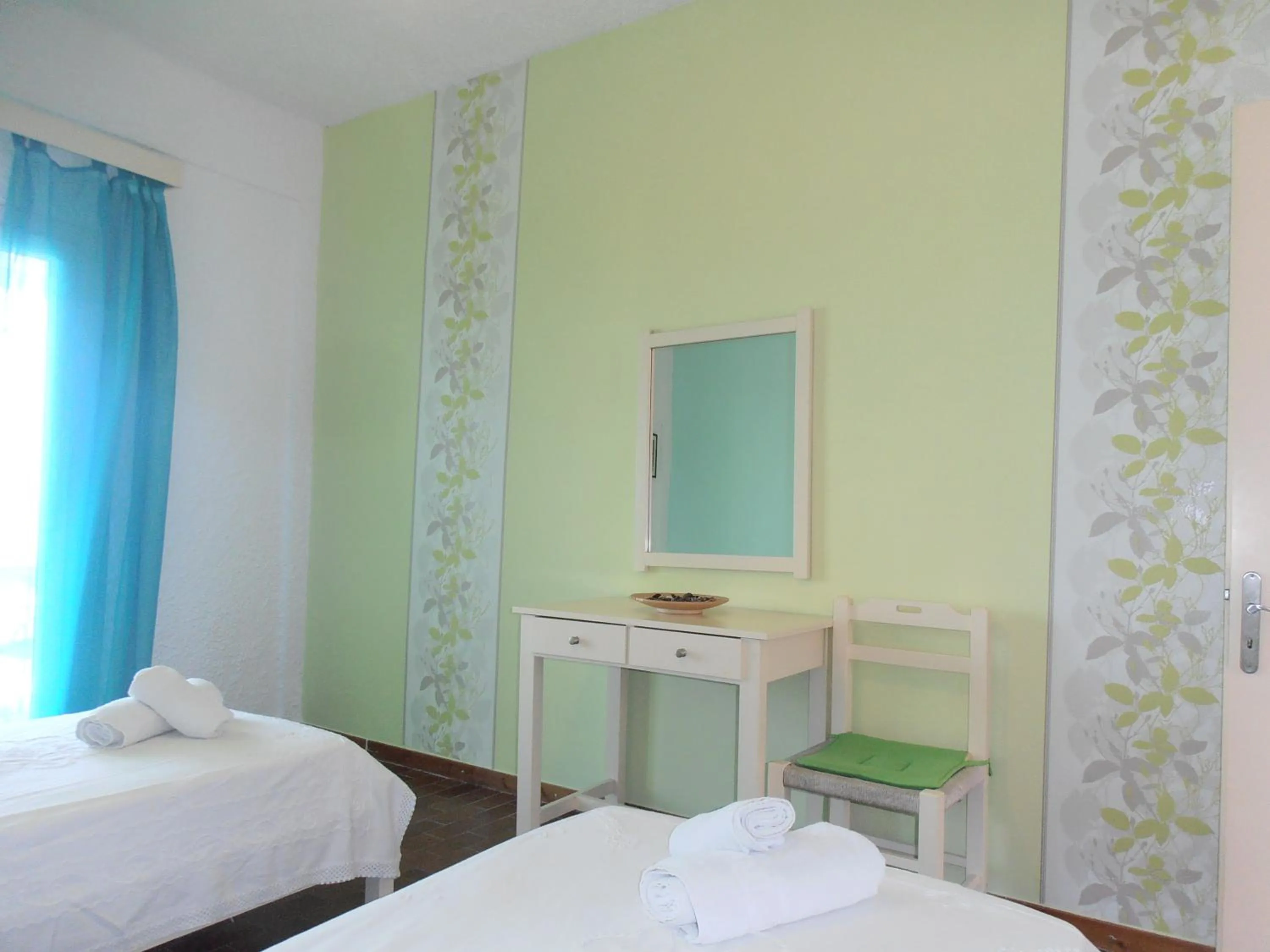 Bed in Elli Beach Apartments and Studios