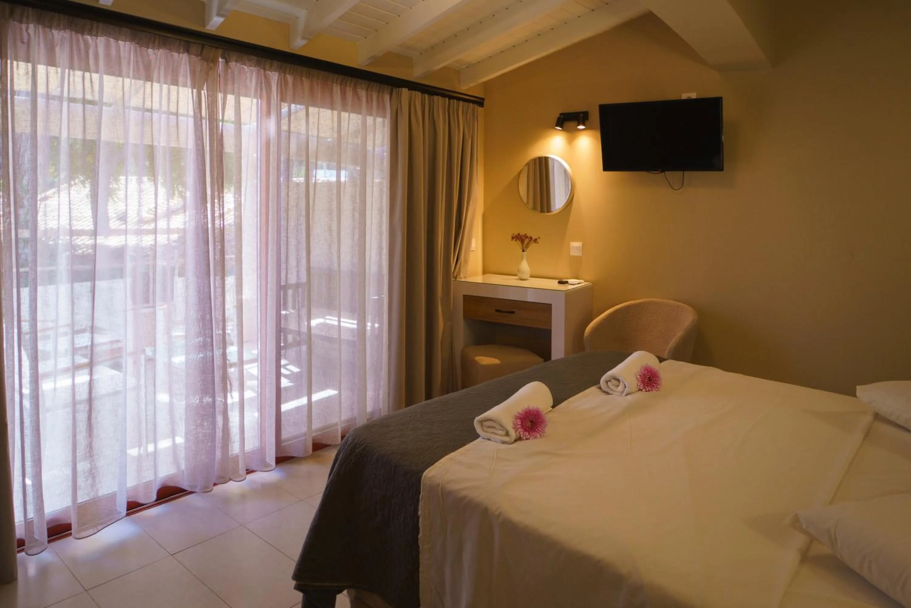 Bed in Rouda Bay Beach Hotel