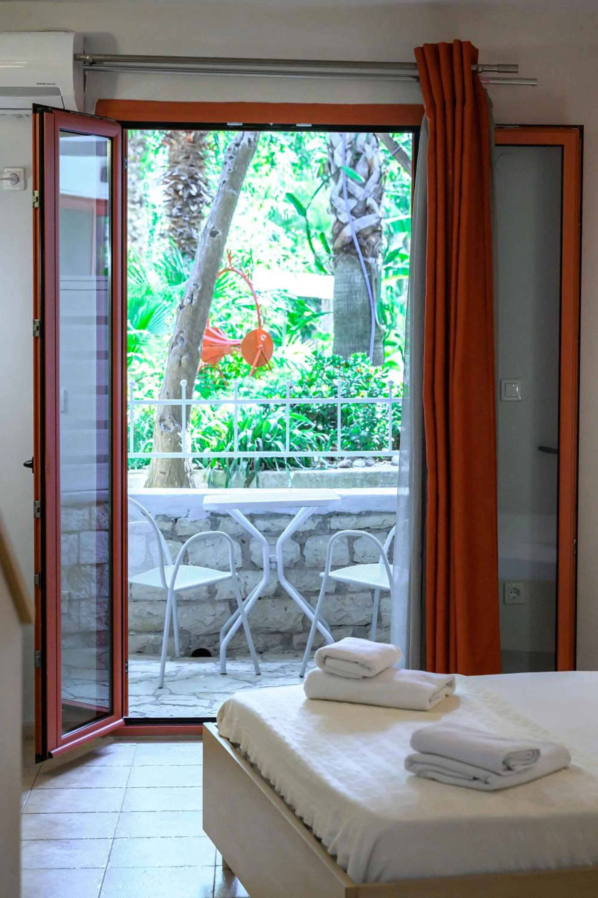 Bed in Rouda Bay Beach Hotel