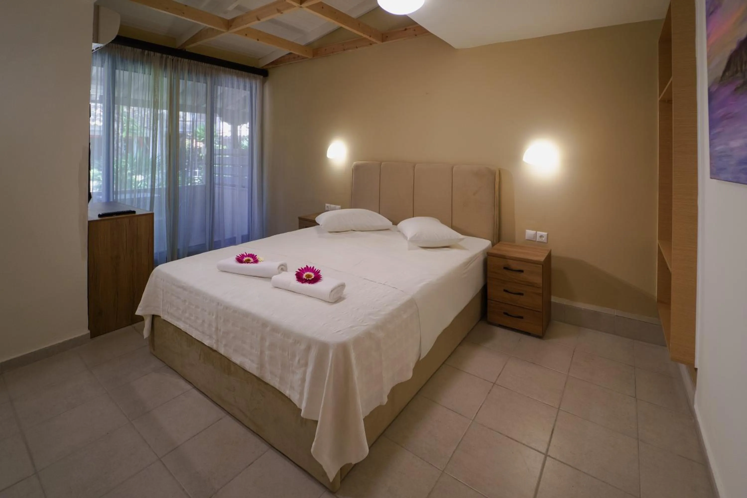 Bed in Rouda Bay Beach Hotel