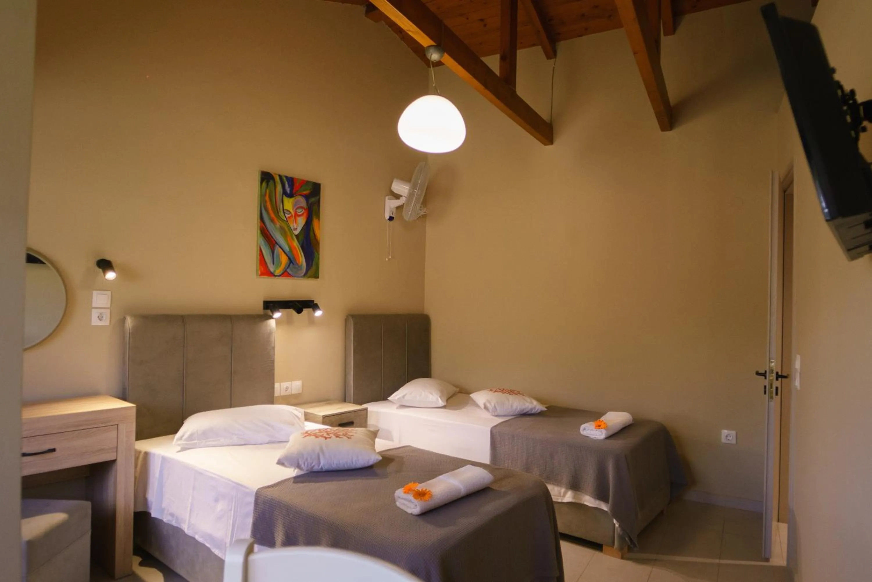 Bed in Rouda Bay Beach Hotel