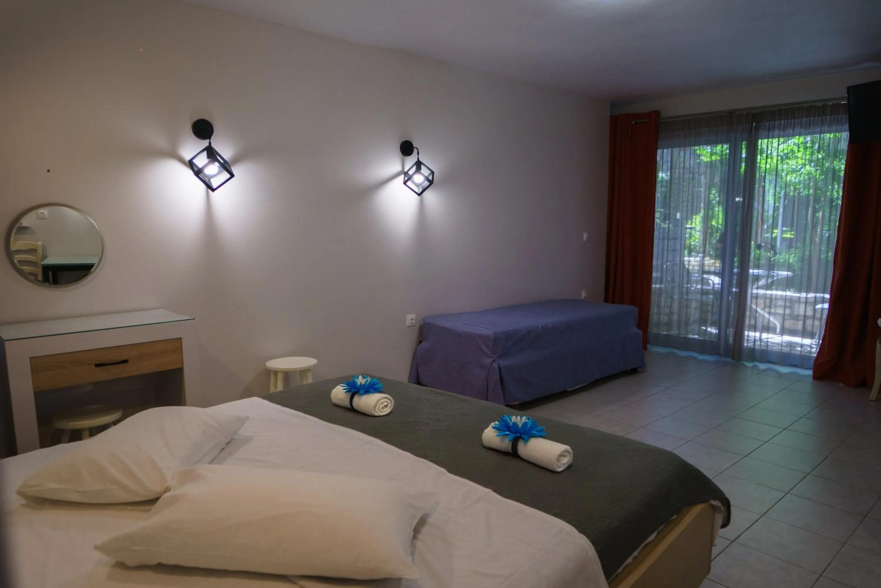 Bed in Rouda Bay Beach Hotel