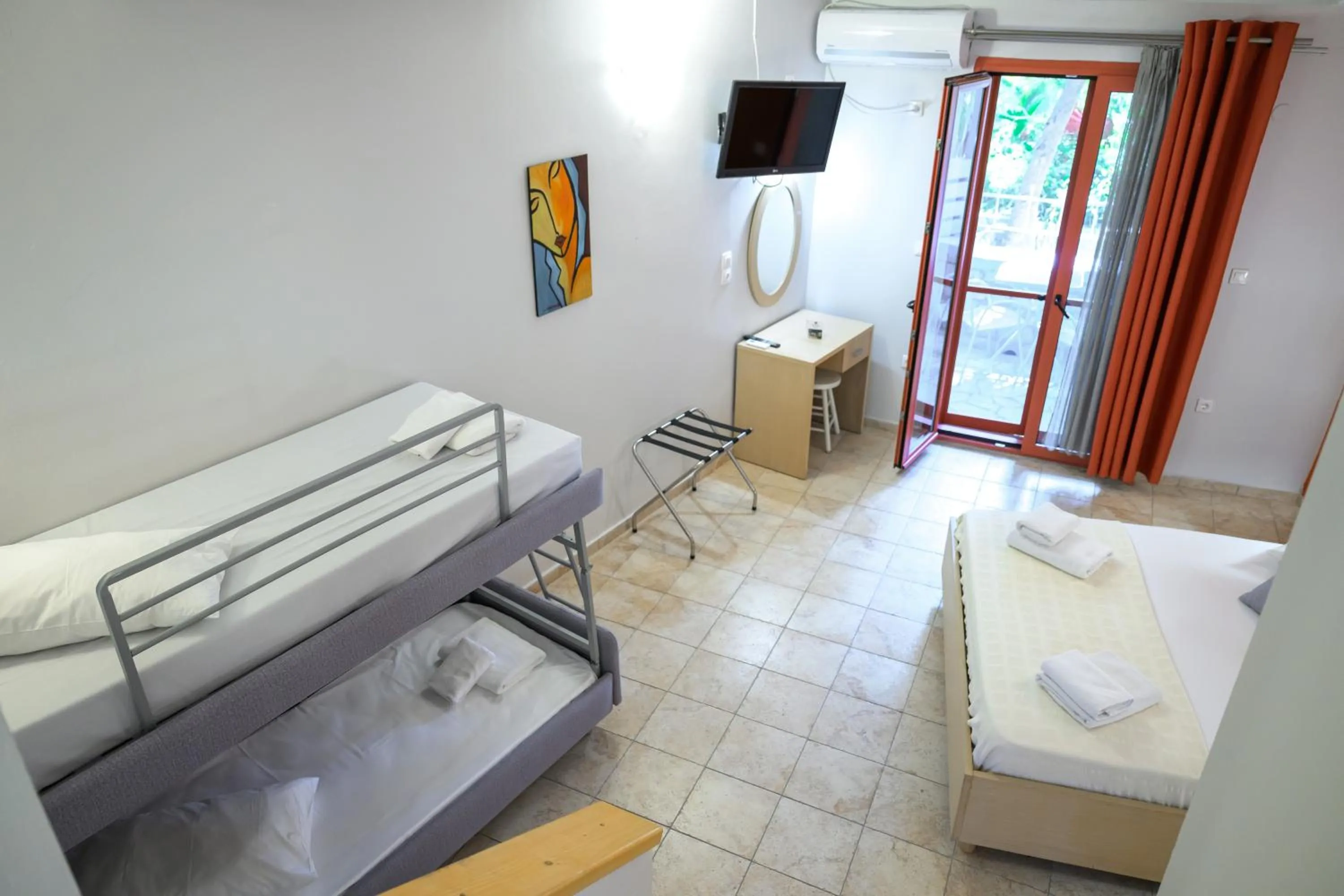 Bed in Rouda Bay Beach Hotel