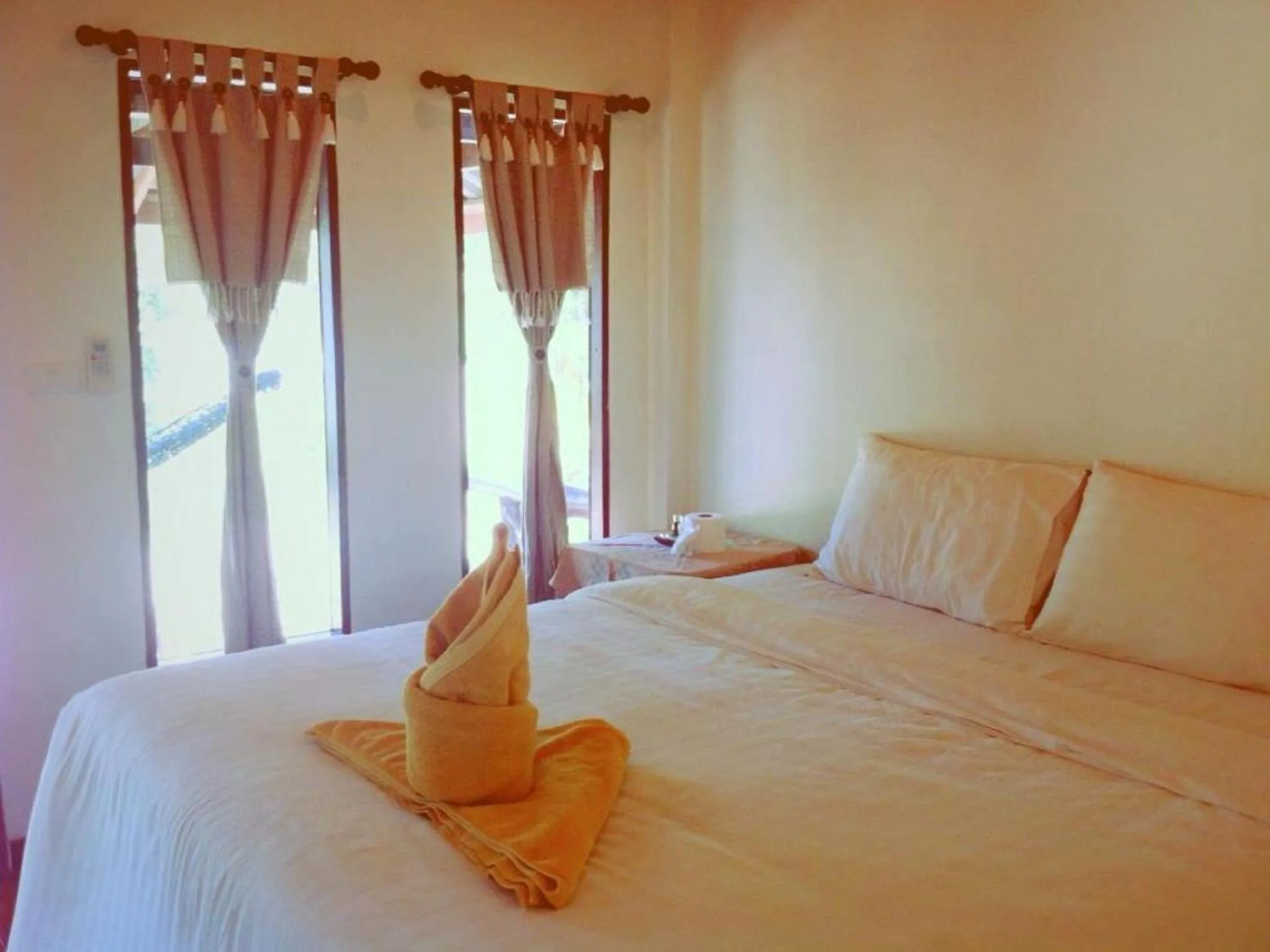 Bed in V-View Beach Resort