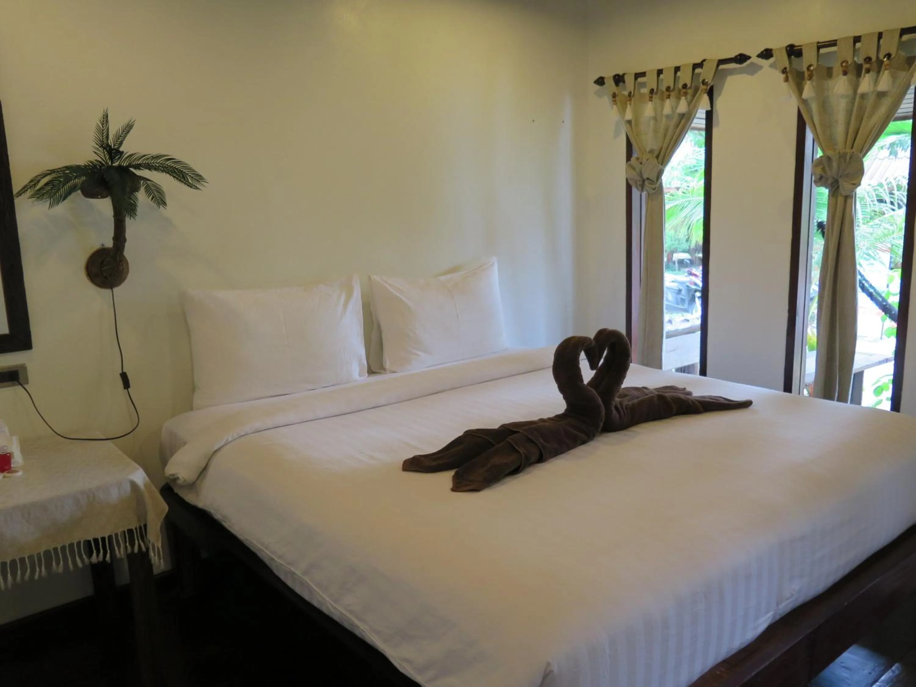 Bed in V-View Beach Resort