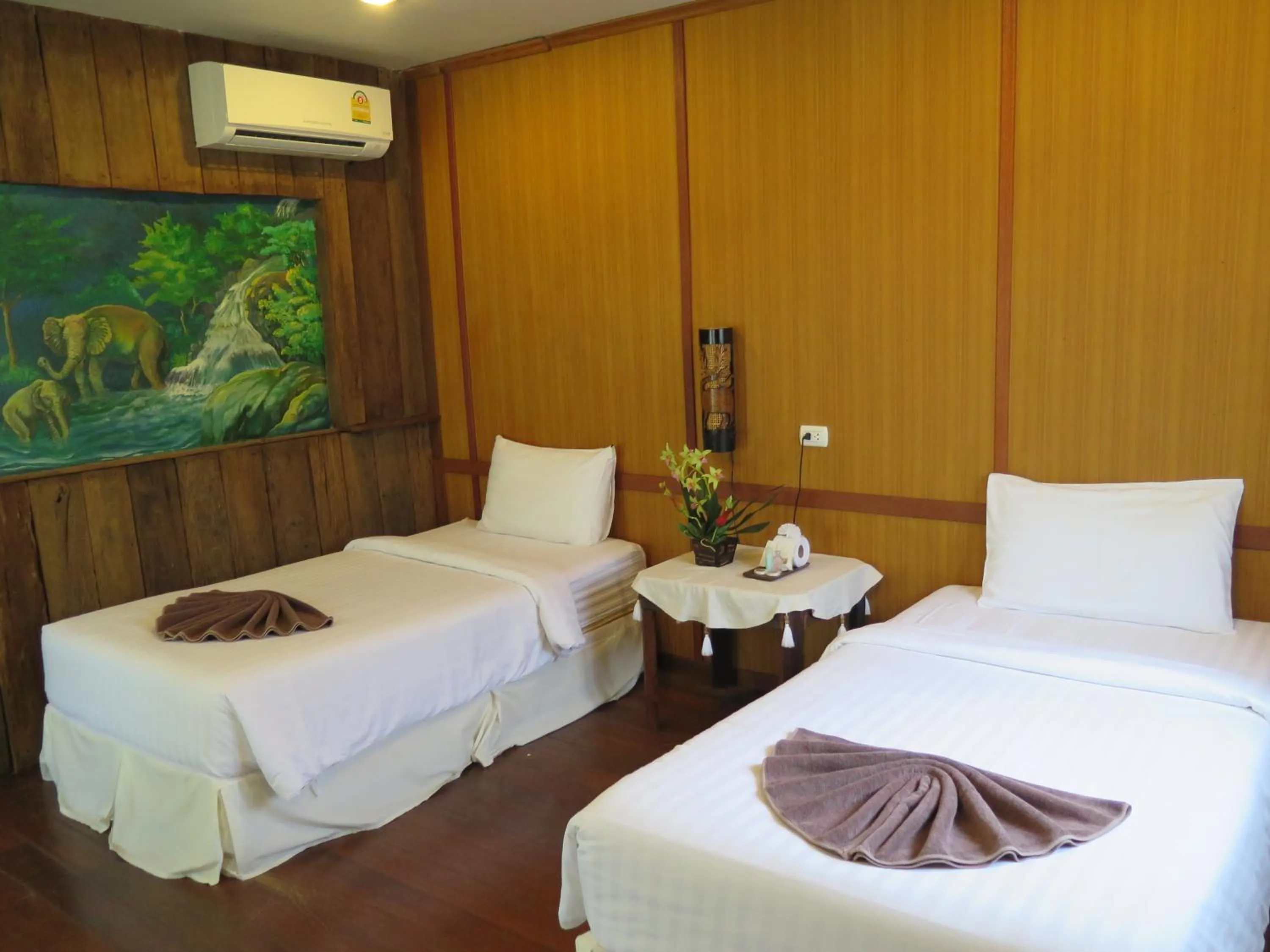 Bed in V-View Beach Resort