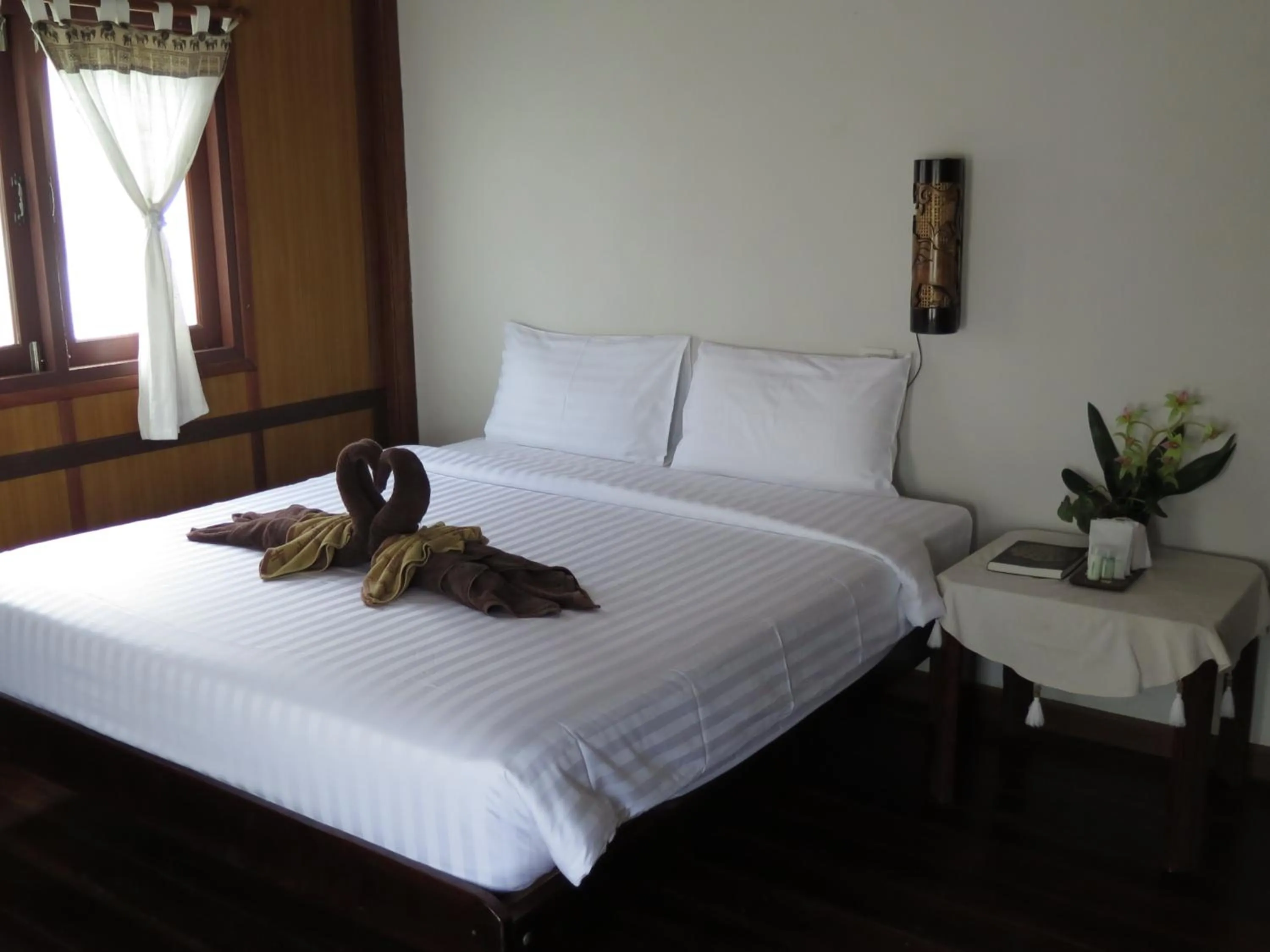 Bed in V-View Beach Resort