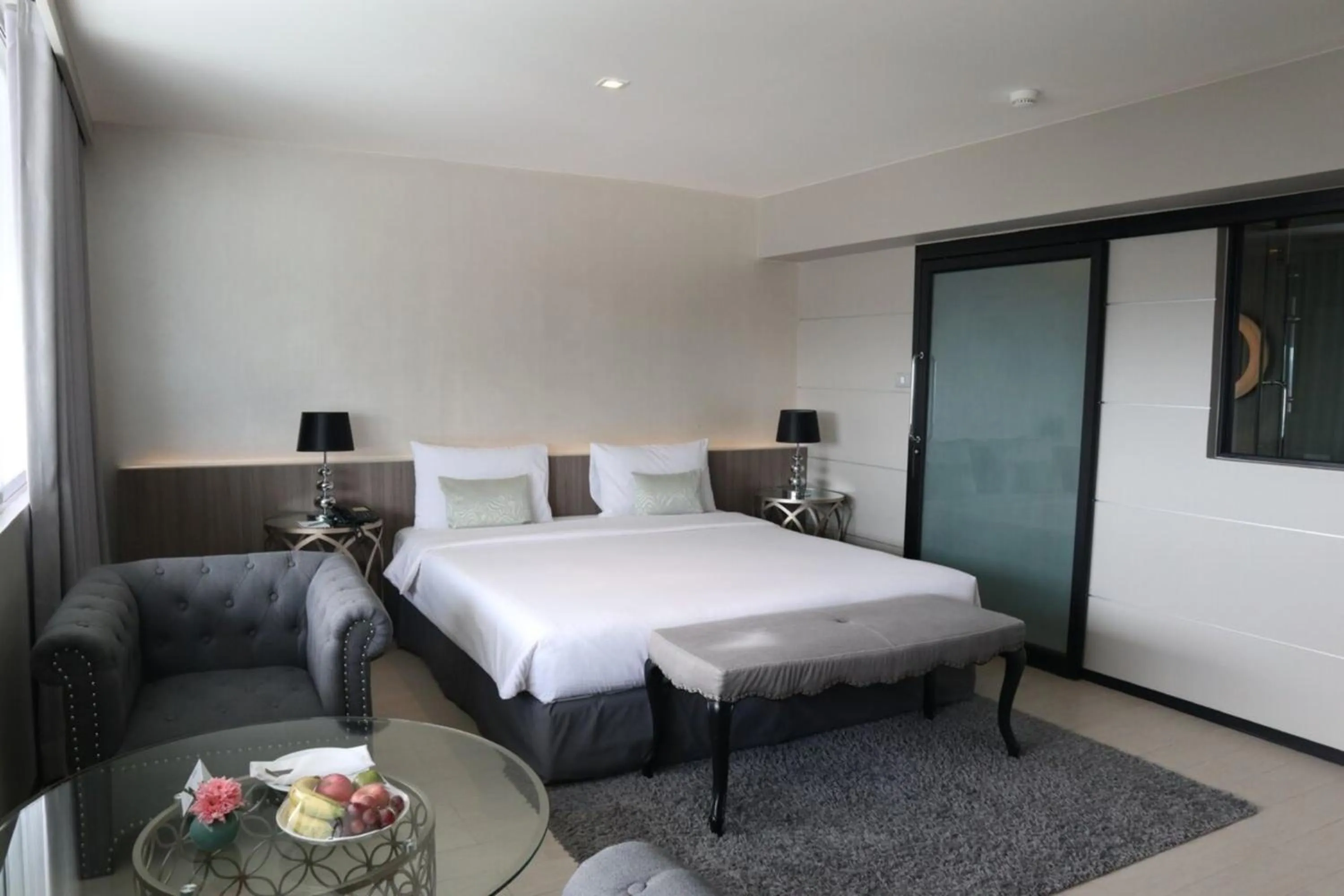 Seating area, Bed in Pearl Hotel Phuket