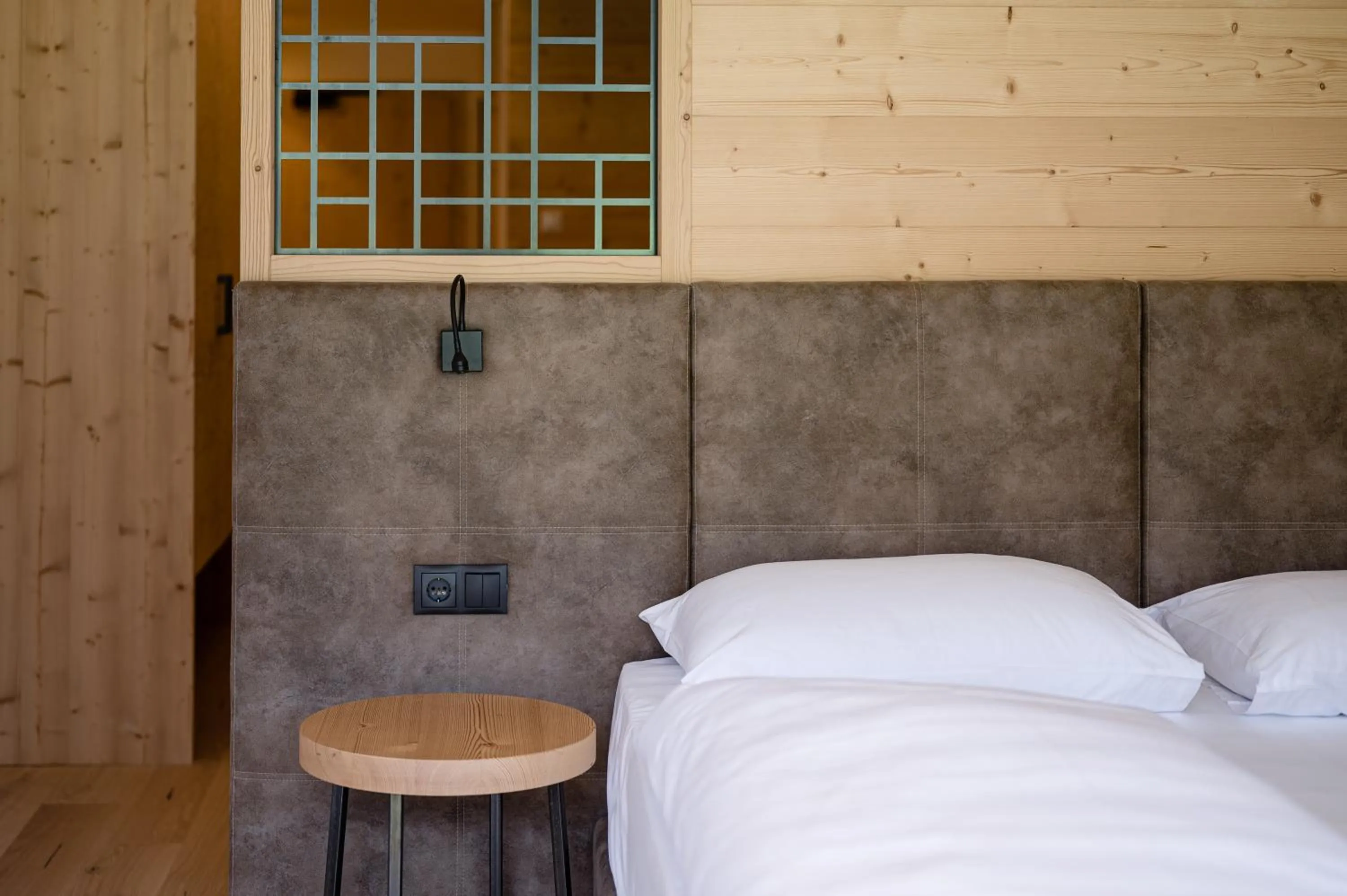 Bed in Alpine Nature Hotel Stoll