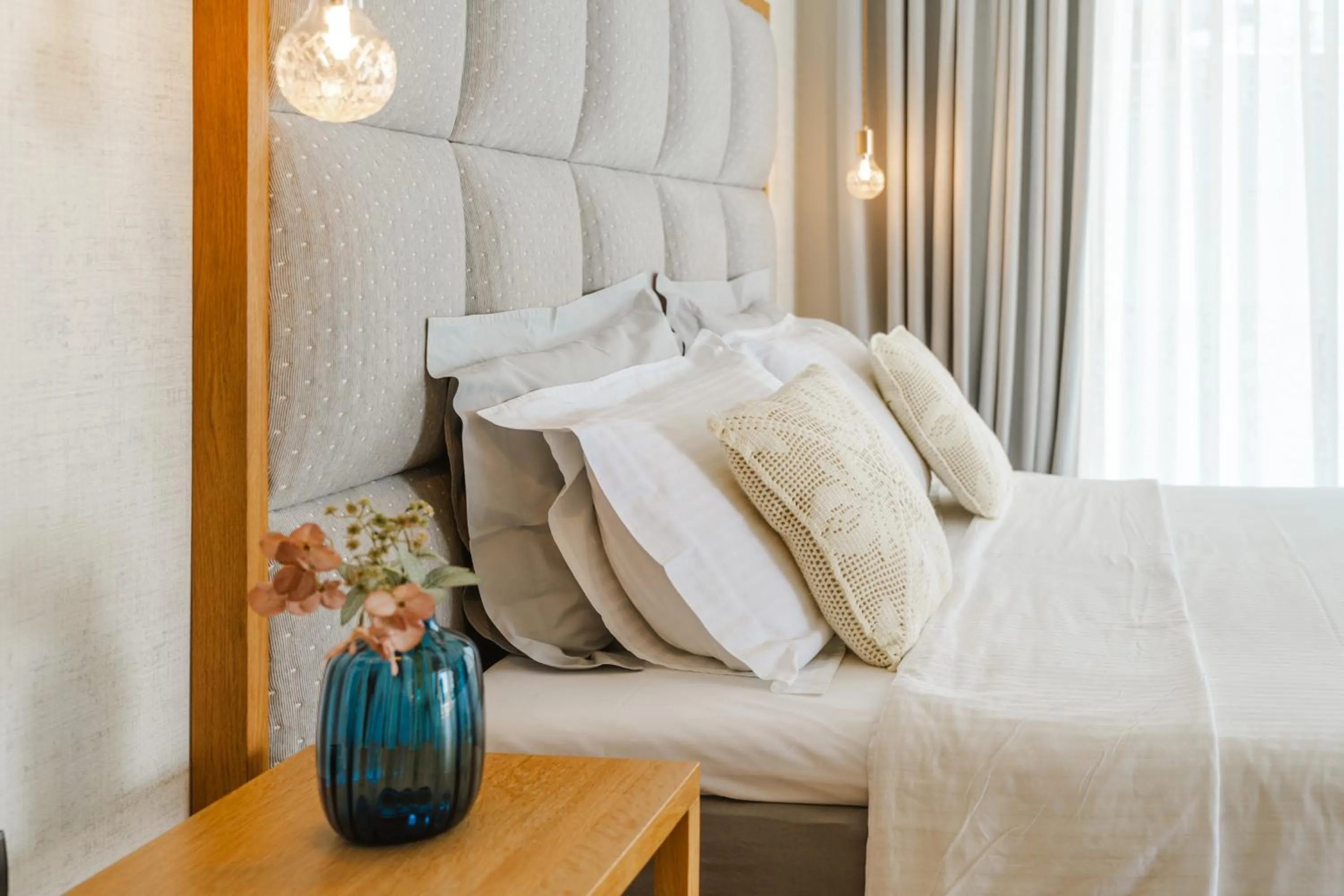 Bed in Glow Boutique Hotel & Suites