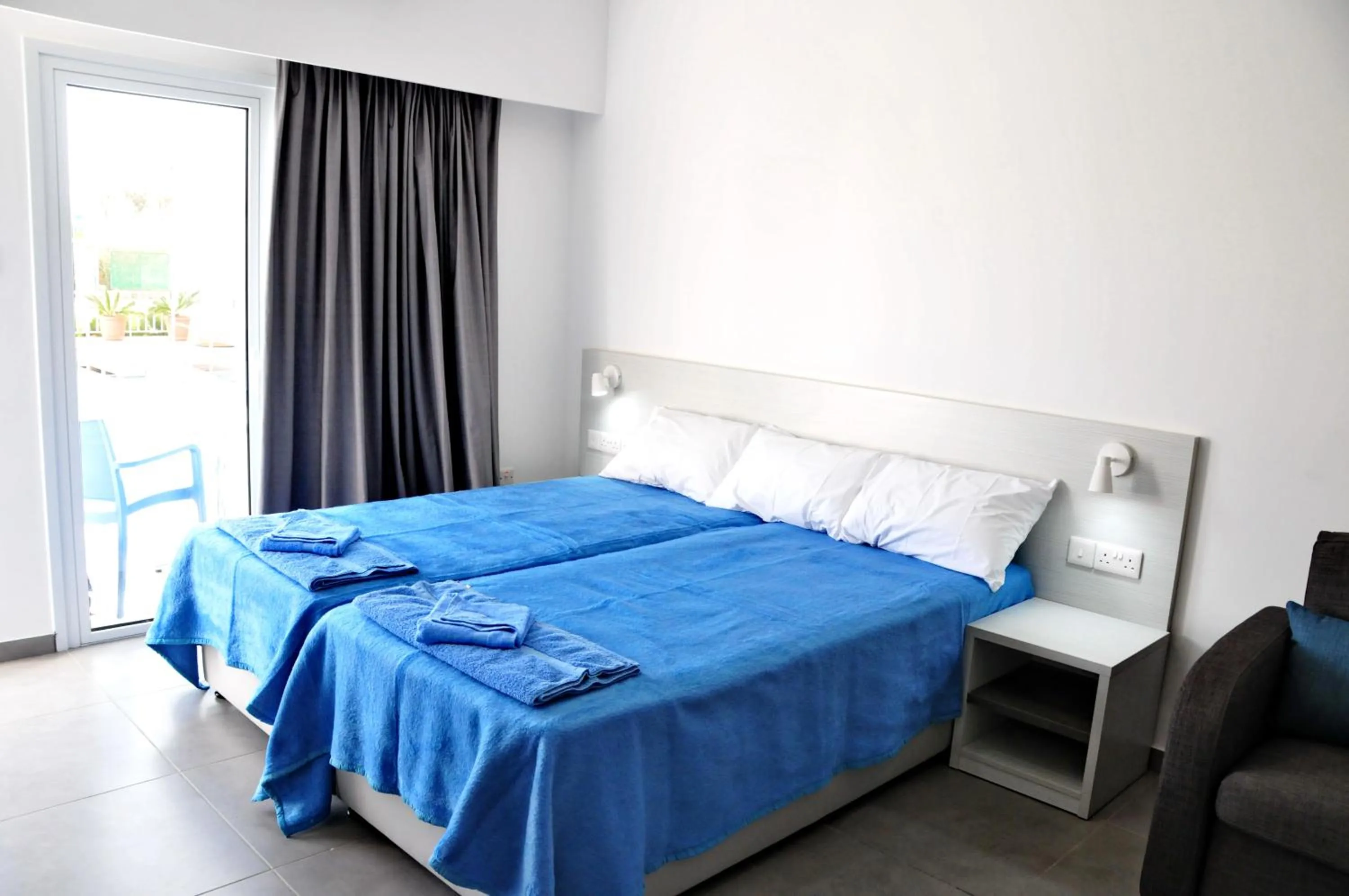 Bed in Kaos Hotel Apartments