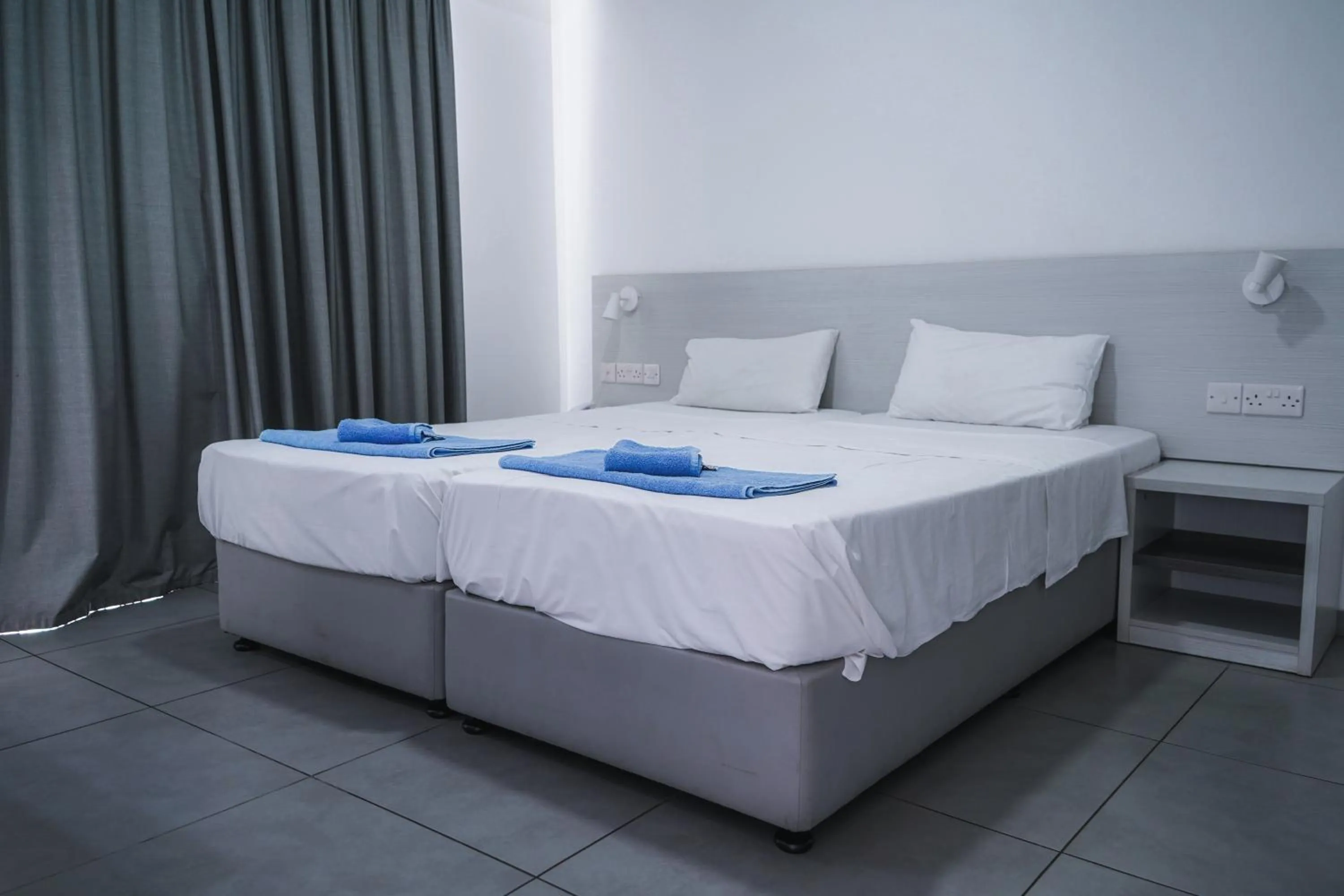 Bed in Kaos Hotel Apartments