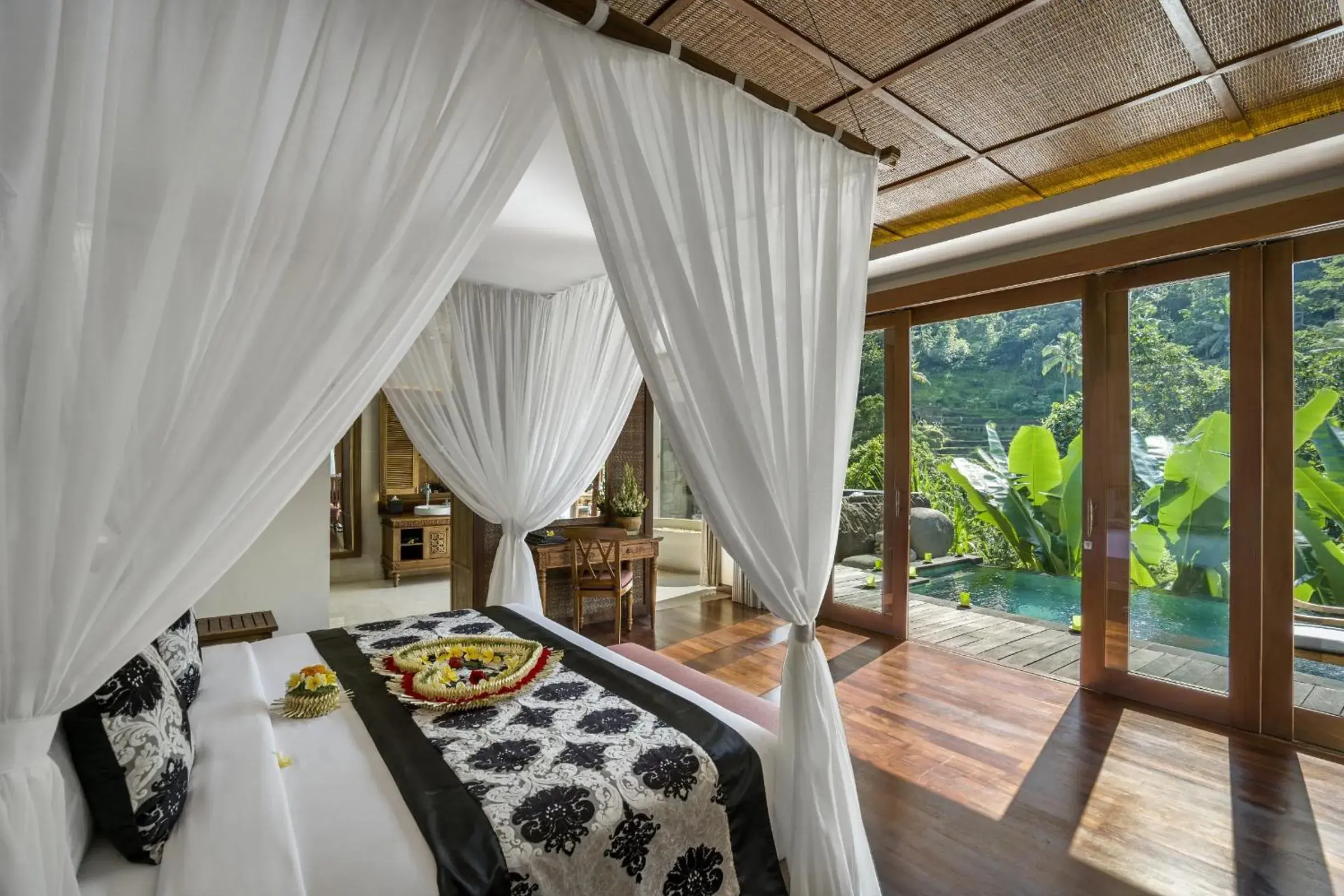Bed in The Kayon Jungle Resort