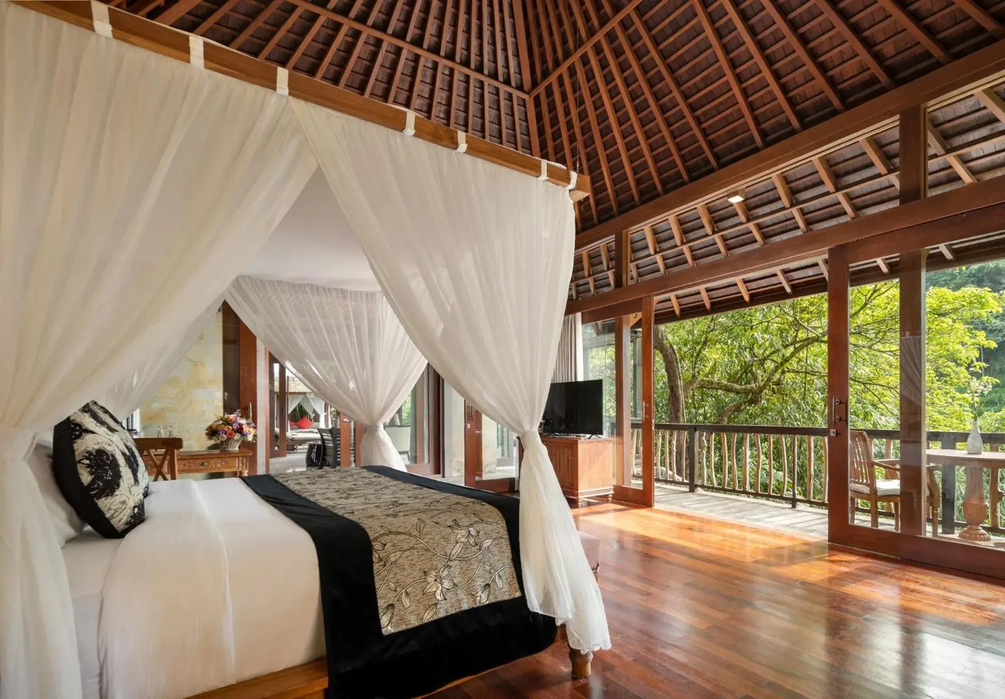 Bed in The Kayon Jungle Resort