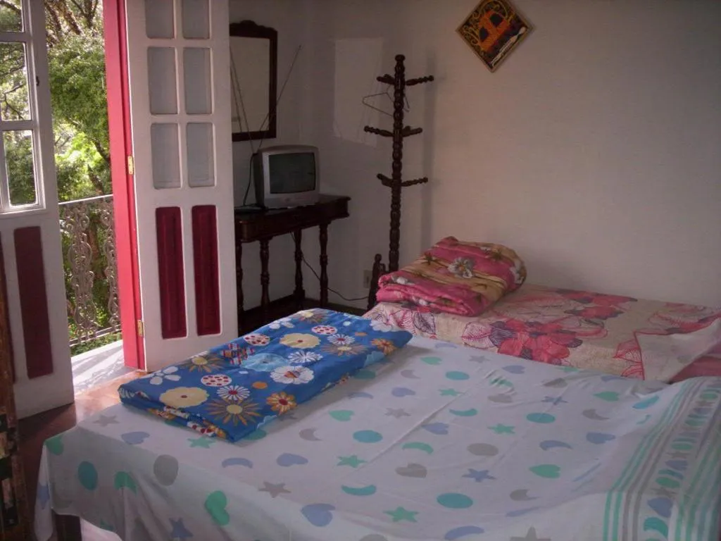 Photo of the whole room, Bed in Pousada Dona Denis