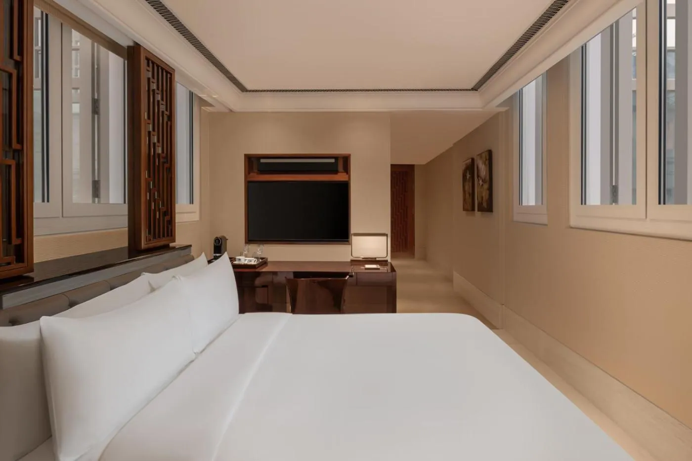 Bed in The Capitol Kempinski Hotel Singapore