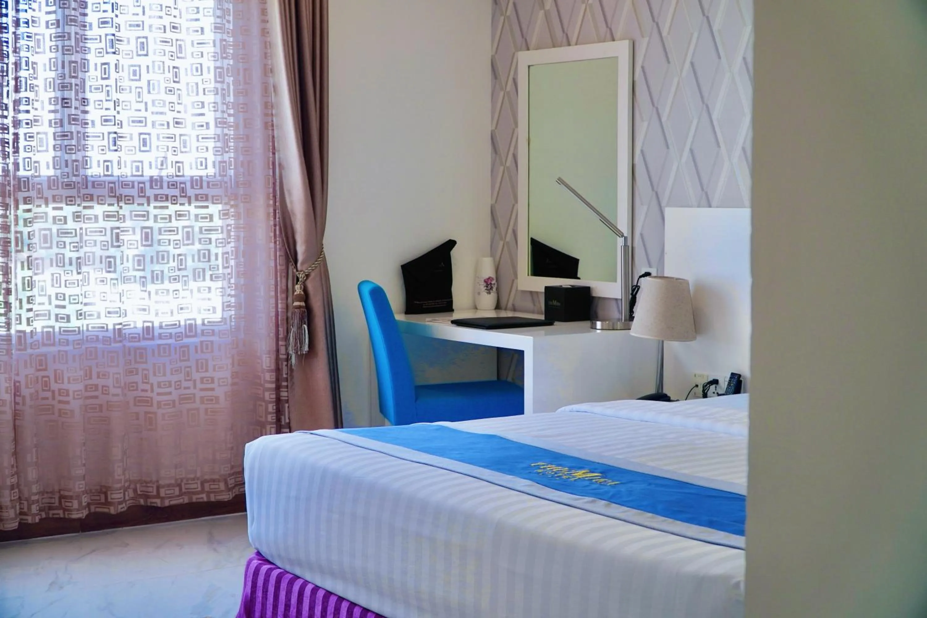 Bed in The Mira Boutique Hotel