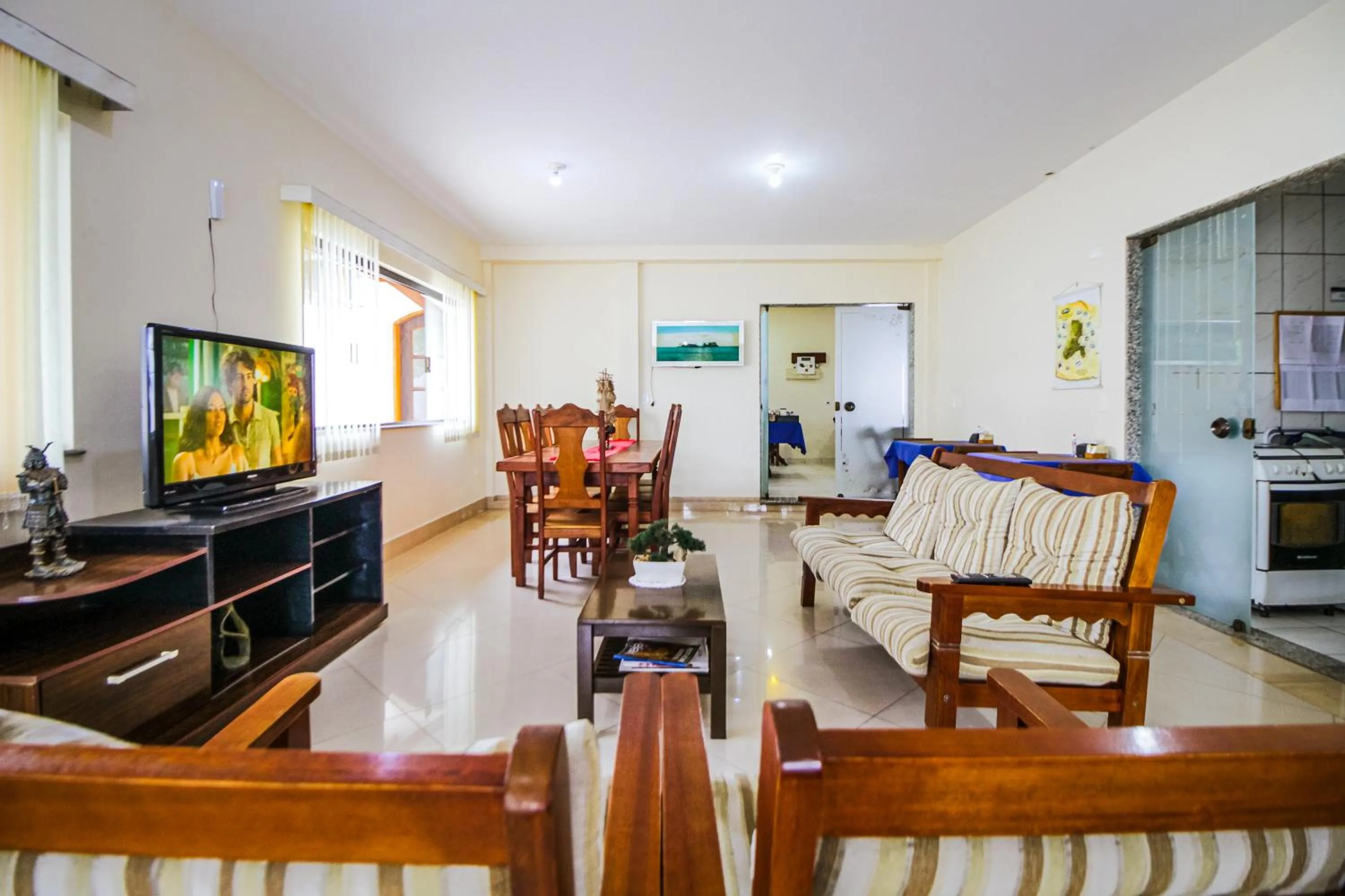 Communal lounge/ TV room in VELINN Pousada Mirante da Praia Grande