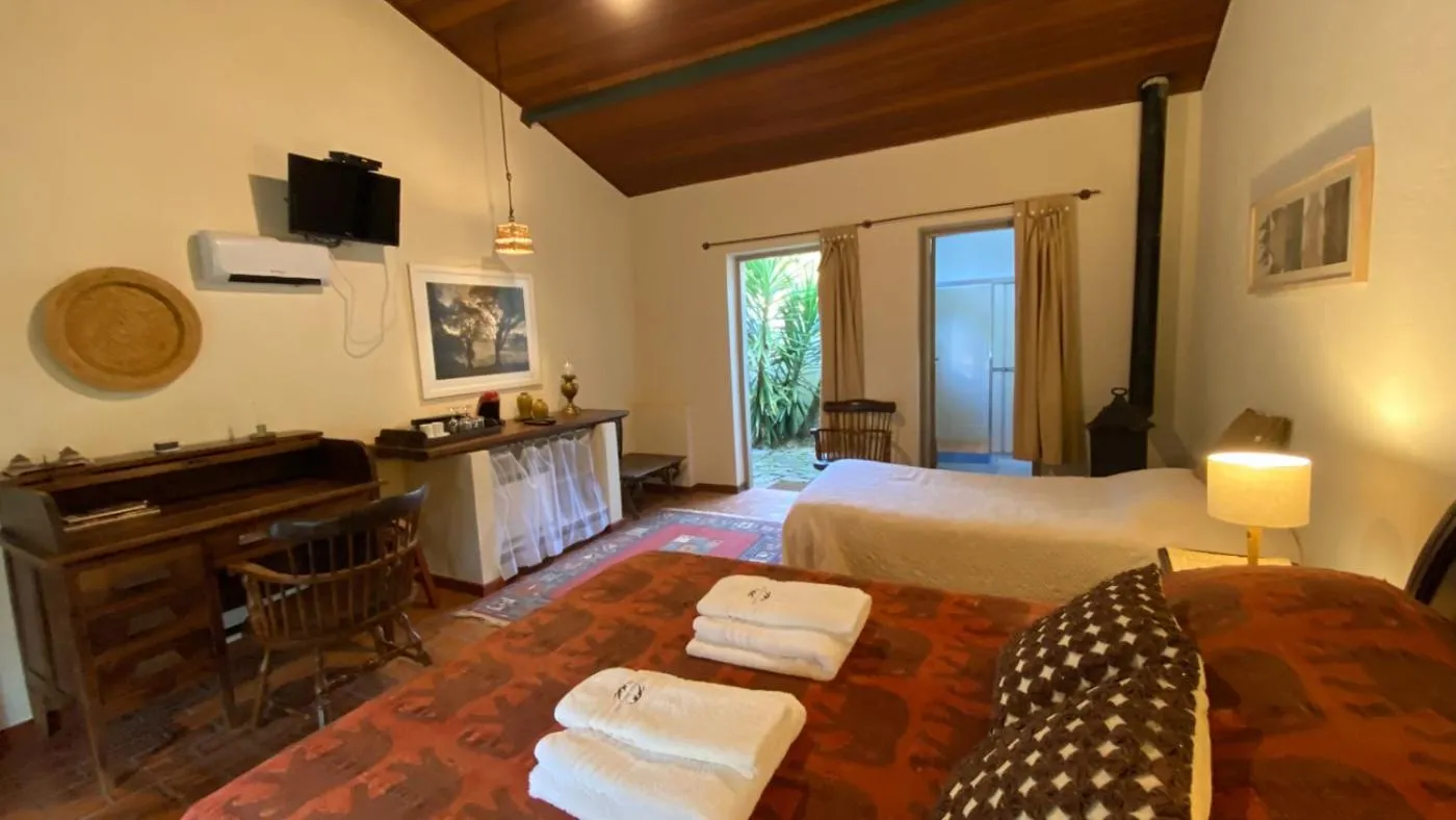 Bed in Pousada dos Anjos