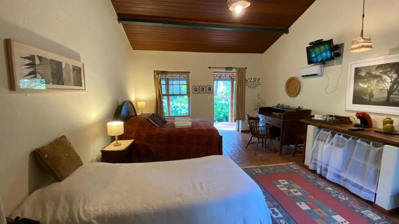 Bed in Pousada dos Anjos