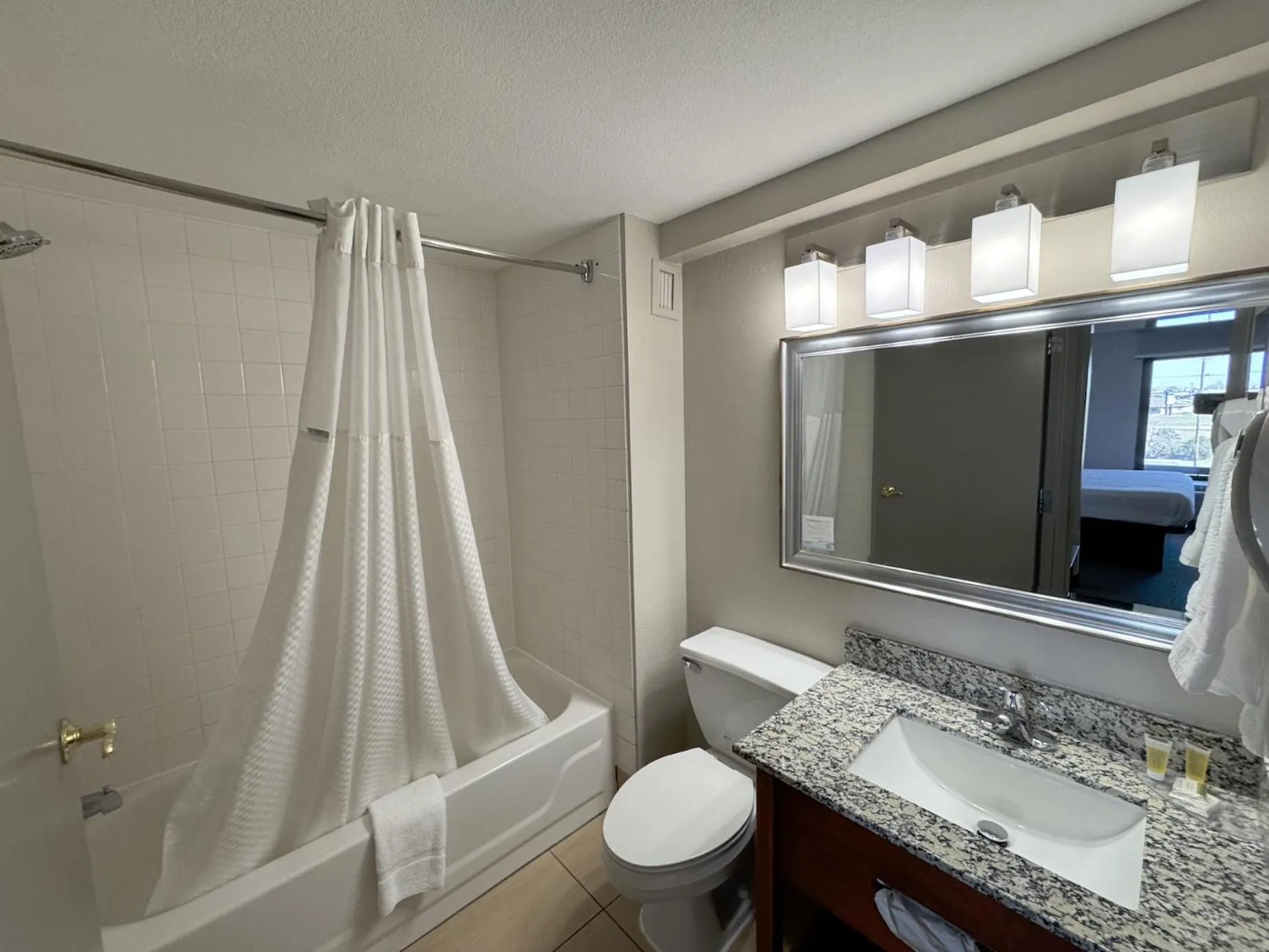 Bathroom in Days Inn & Suites by Wyndham Cedar Rapids