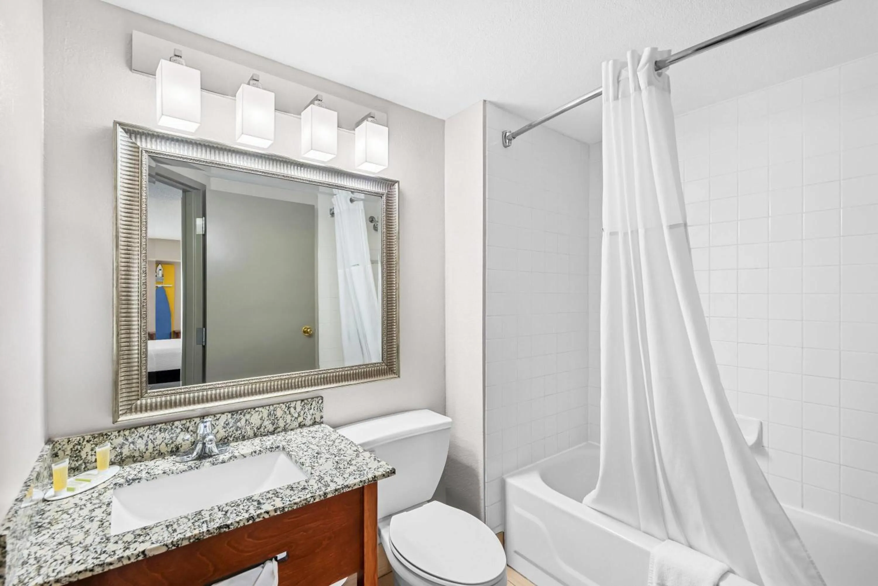 Bathroom in Days Inn & Suites by Wyndham Cedar Rapids