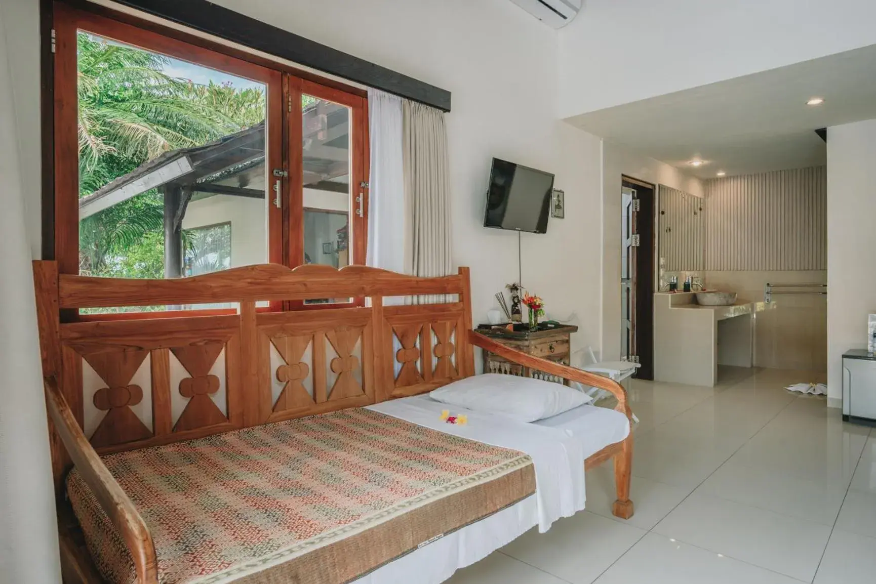 Bed in Frangipani Beach Hotel Bed in Frangipani Beach Hotel