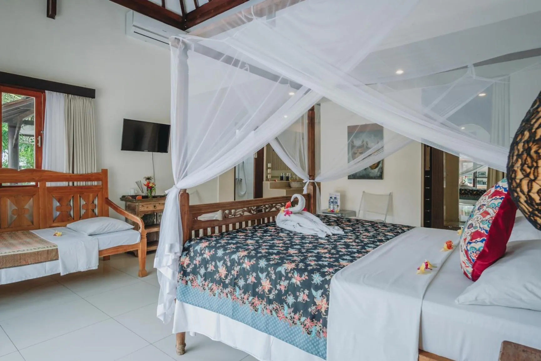 Bed in Frangipani Beach Hotel