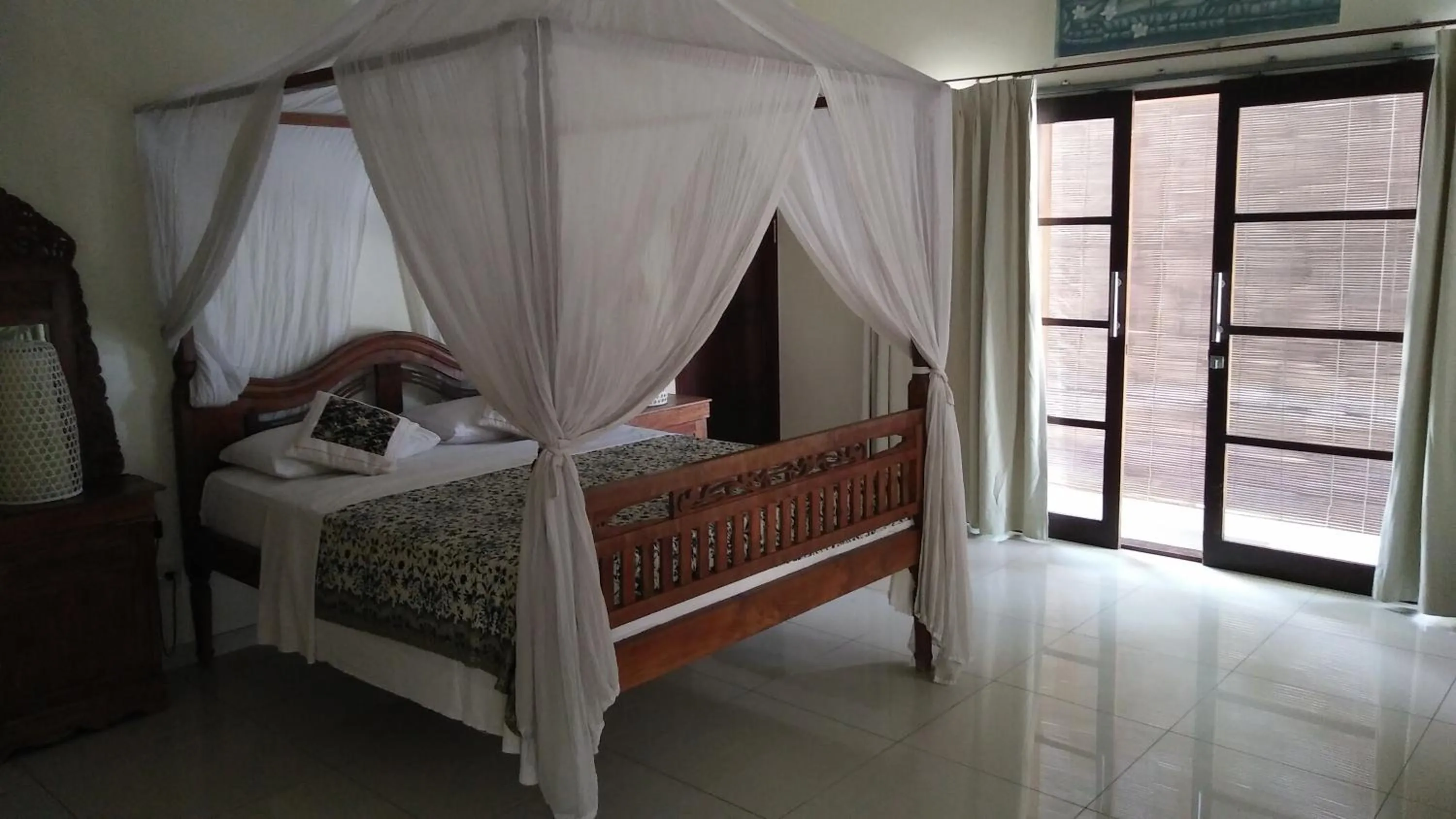 Bed in Frangipani Beach Hotel