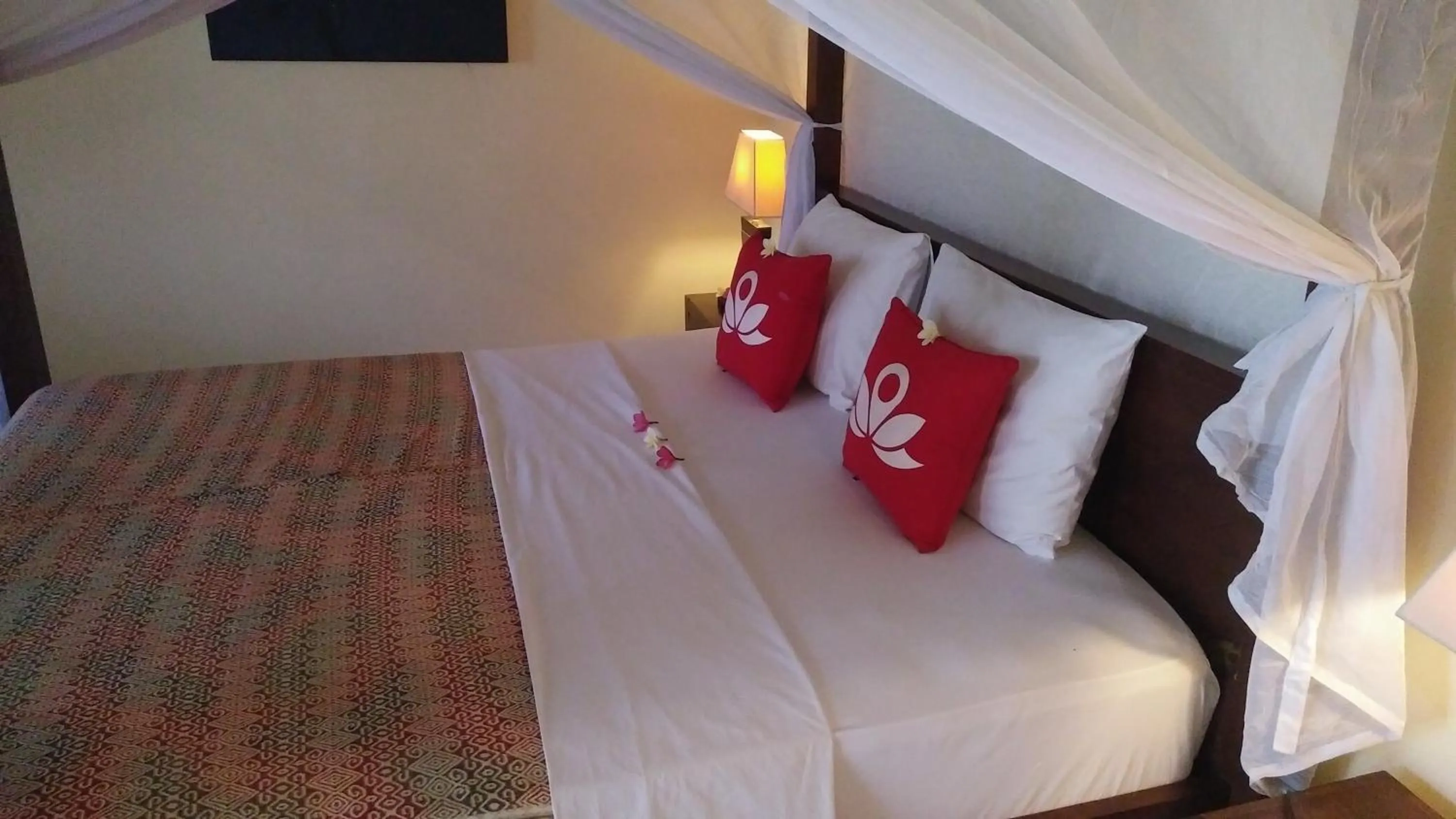 Bed in Frangipani Beach Hotel