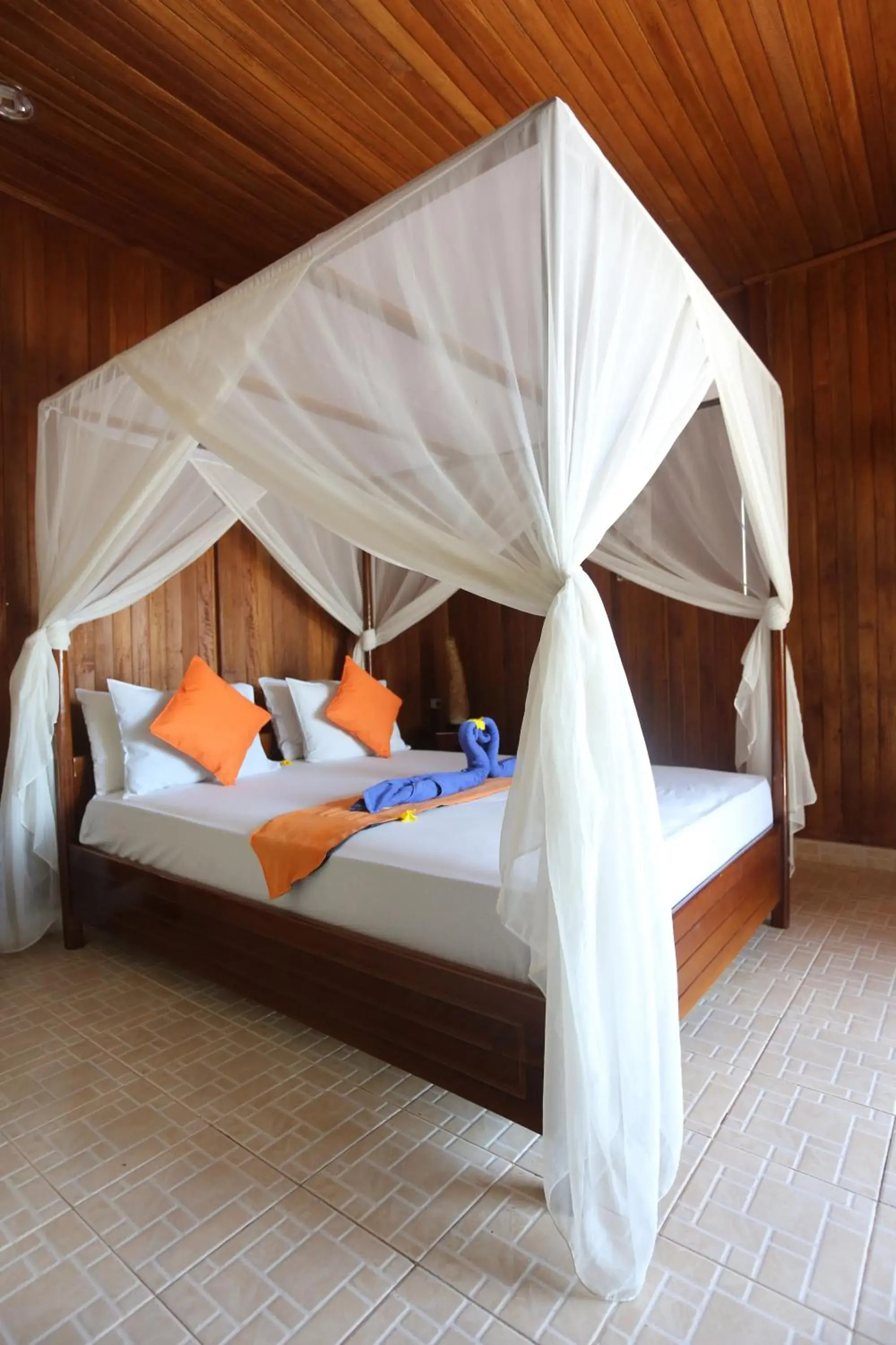 Bed in Bastianos Bunaken Dive Resort