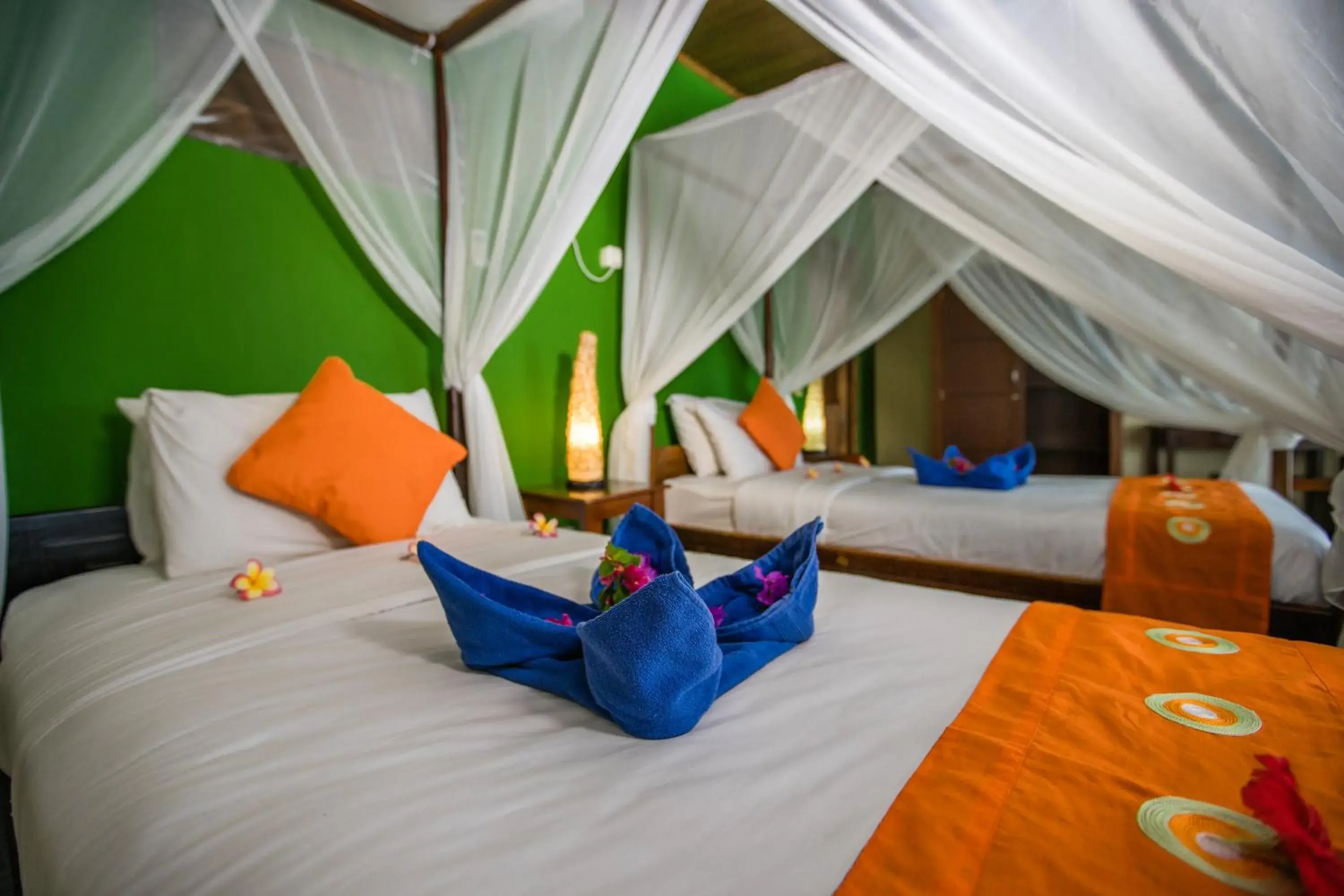 Bed in Bastianos Bunaken Dive Resort