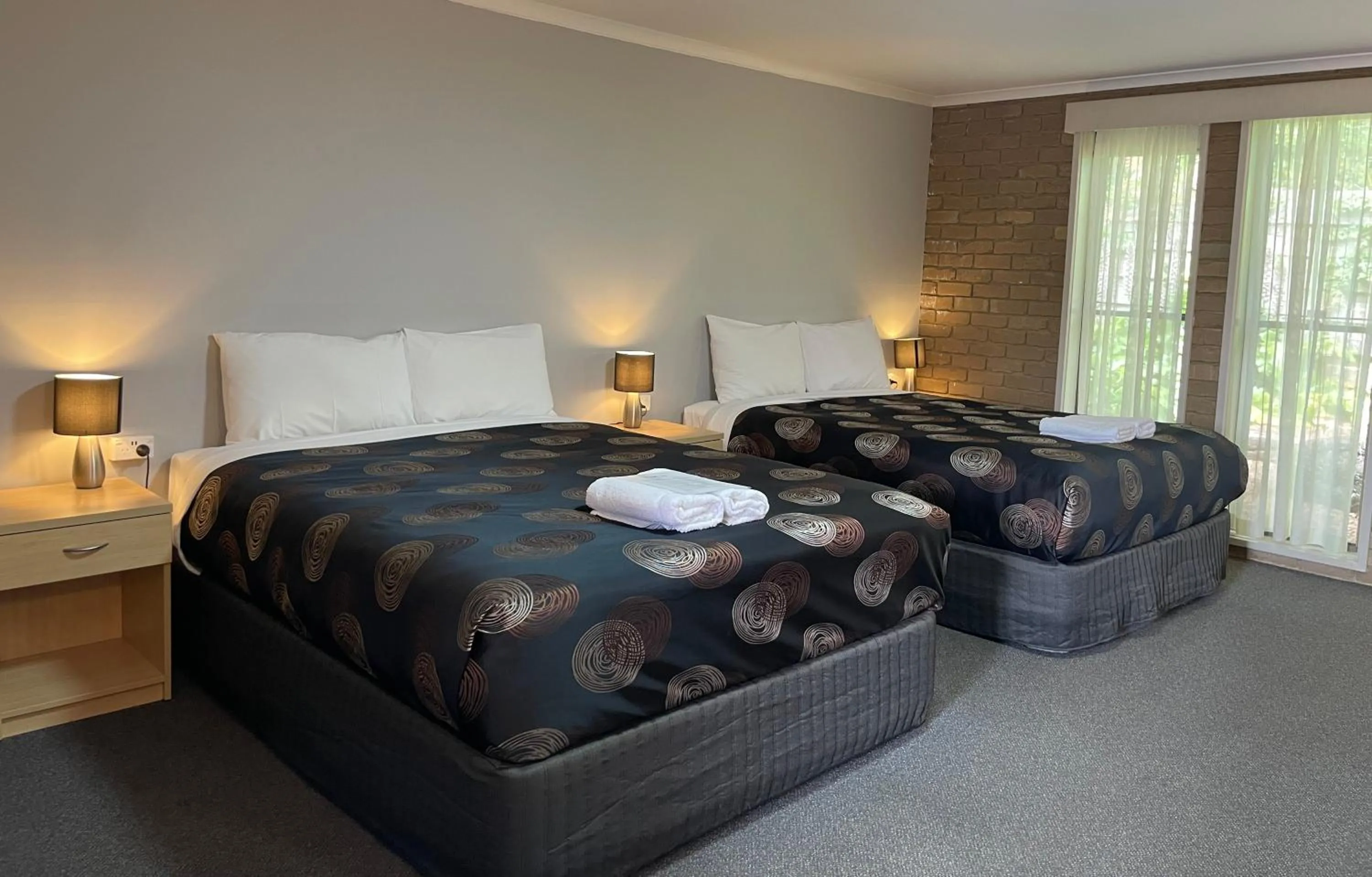 Bed in Tropicana Motor Inn