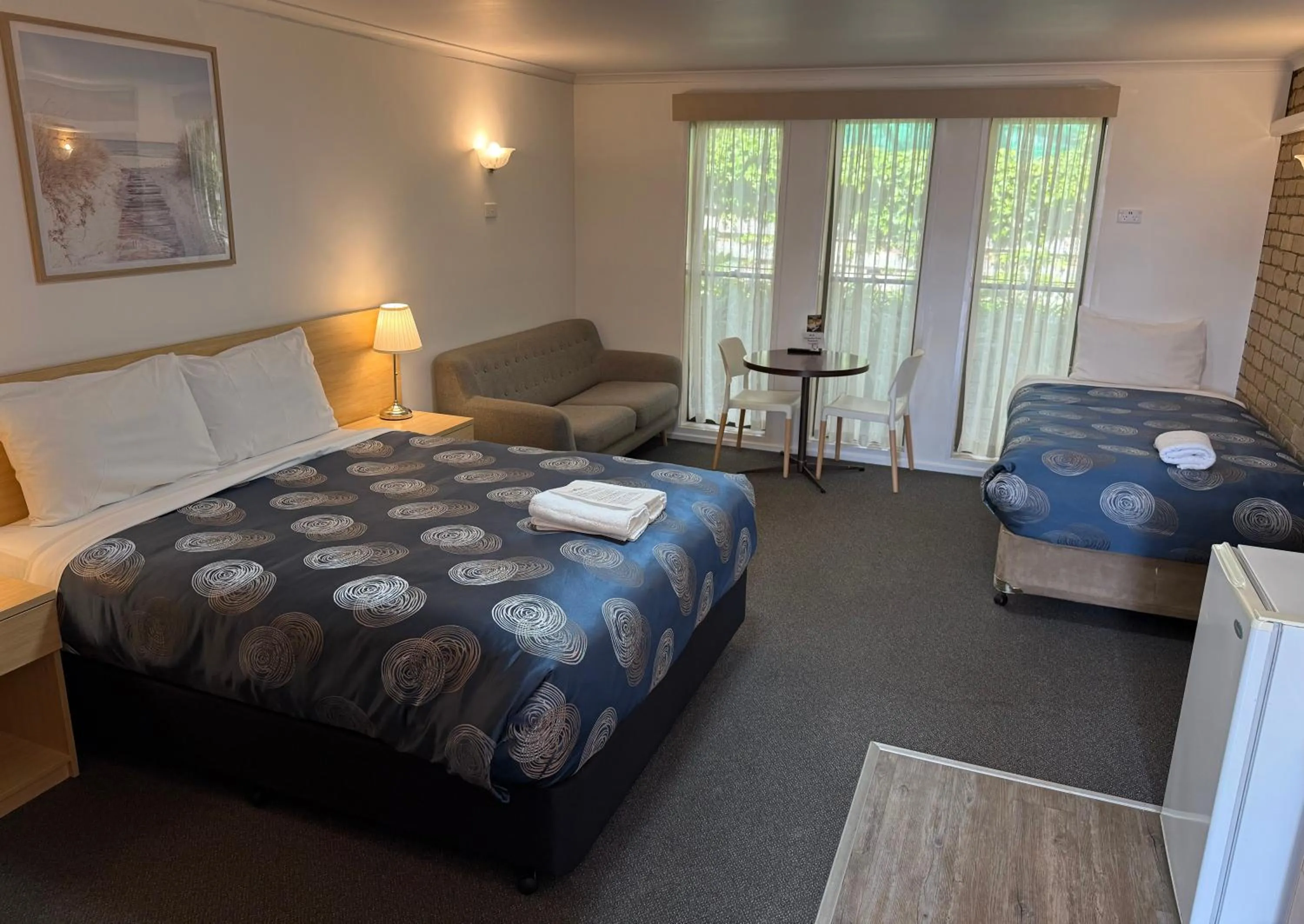 Bed in Tropicana Motor Inn