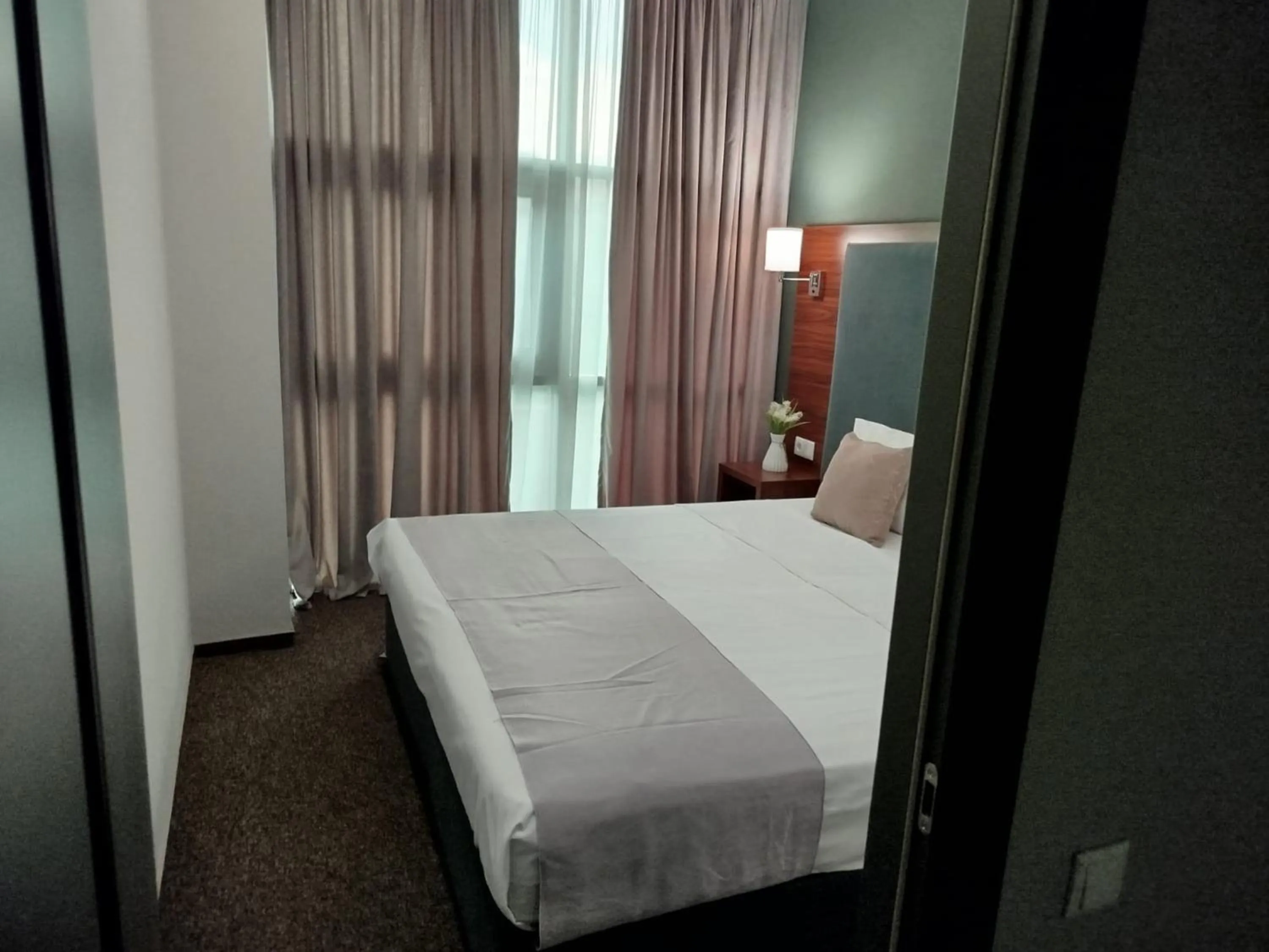 Bed in Green Tower Hotel