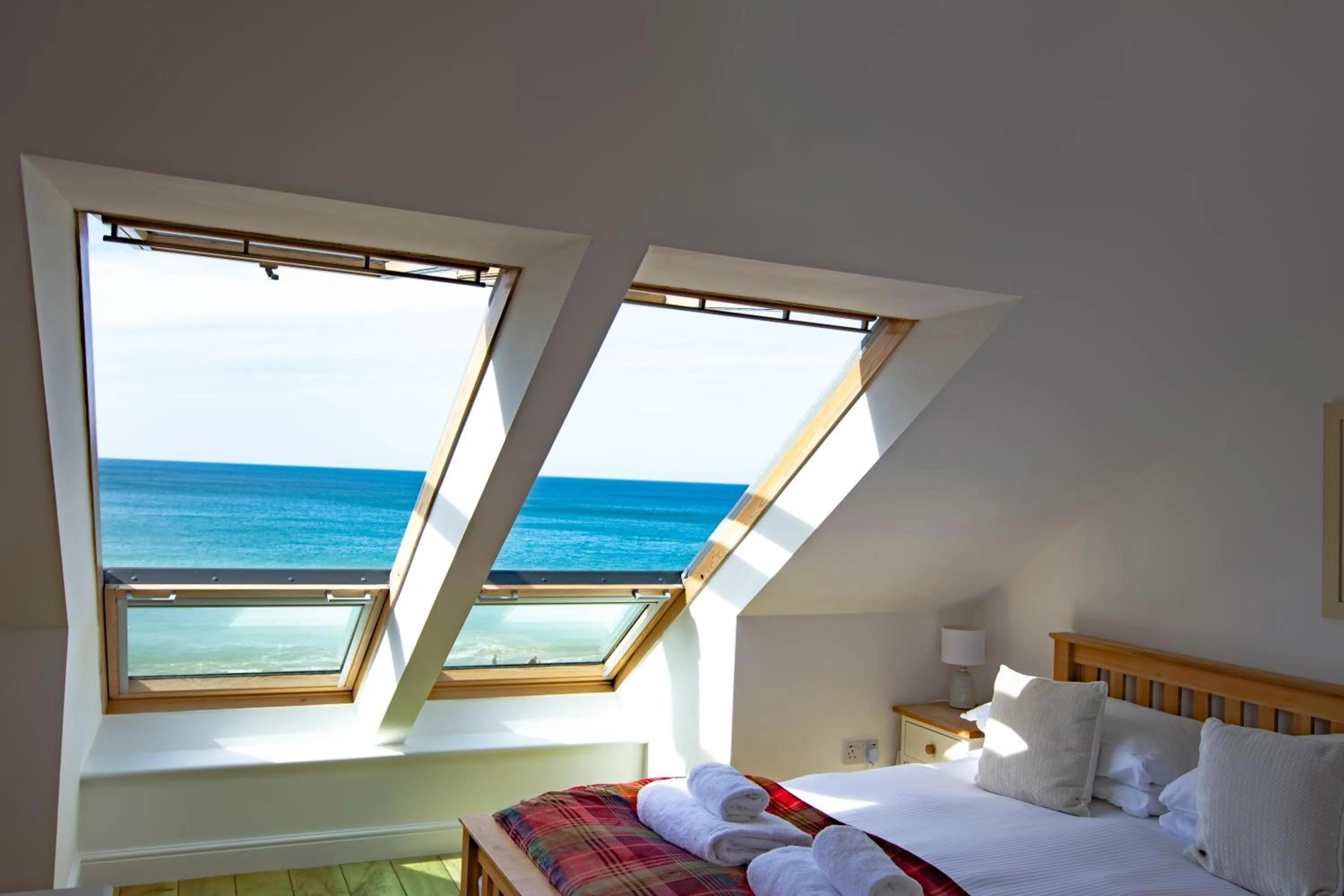 Bed in Tolcarne Beach Apartments