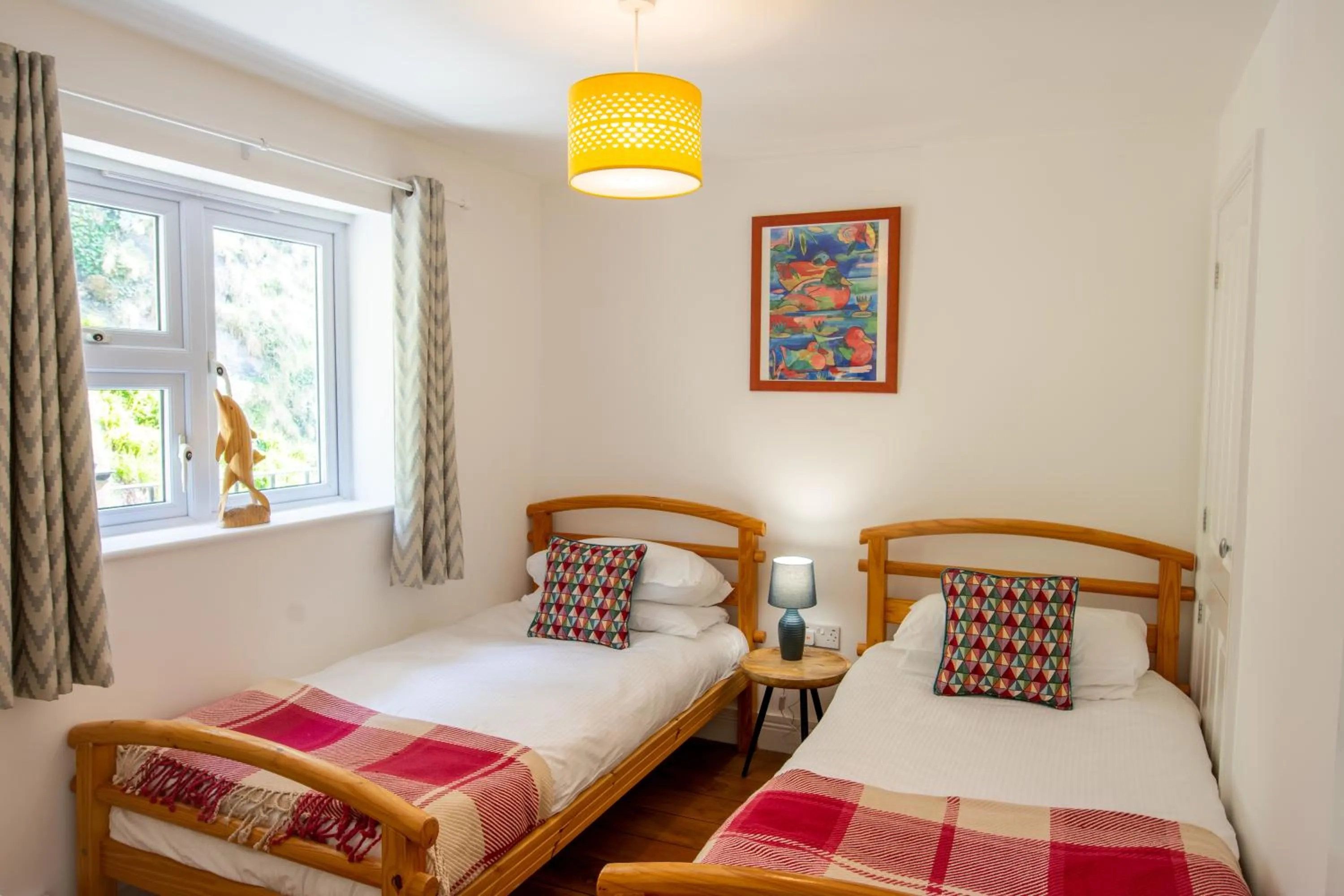 Bed in Tolcarne Beach Apartments