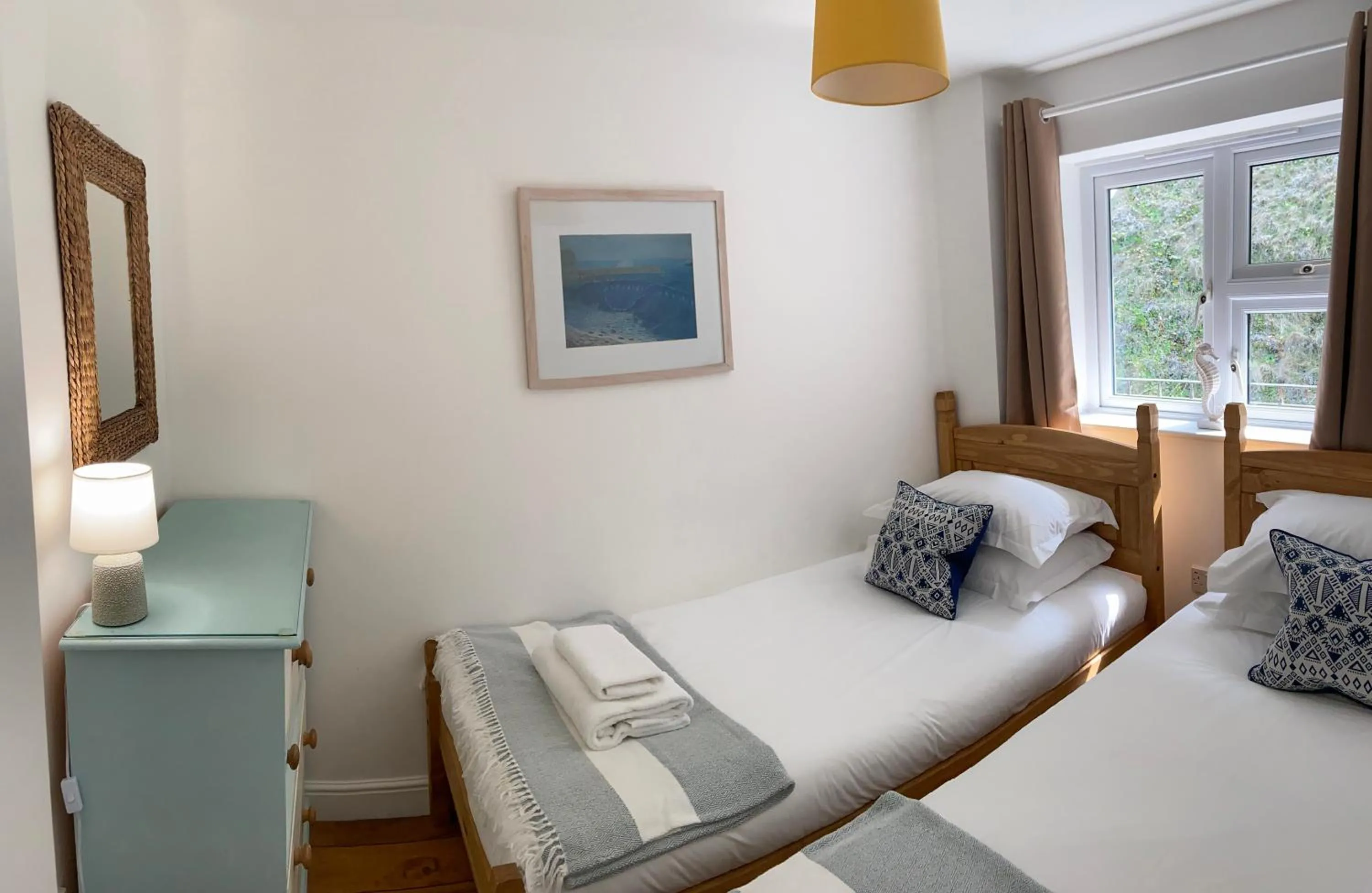 Bed in Tolcarne Beach Apartments