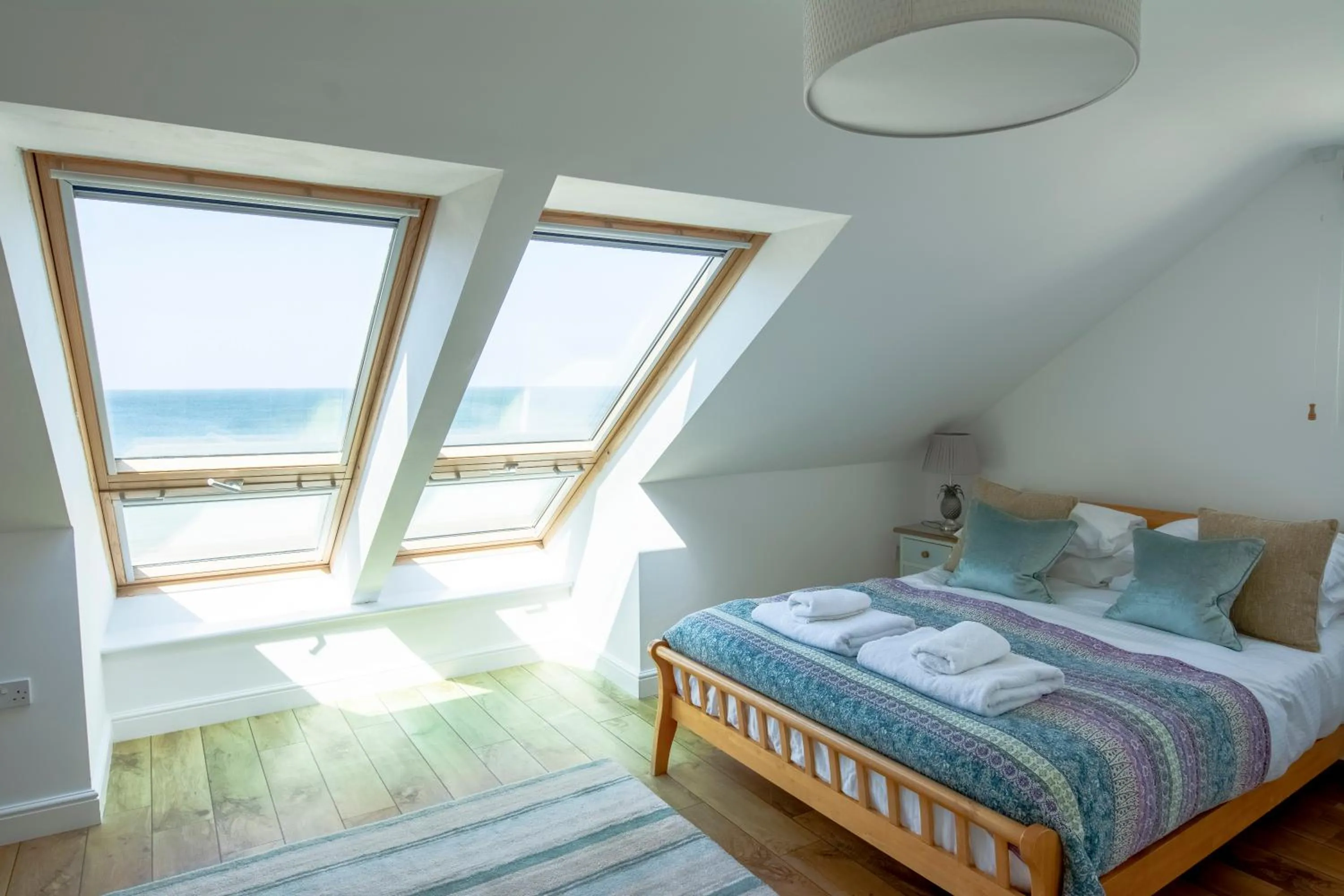 Bed in Tolcarne Beach Apartments