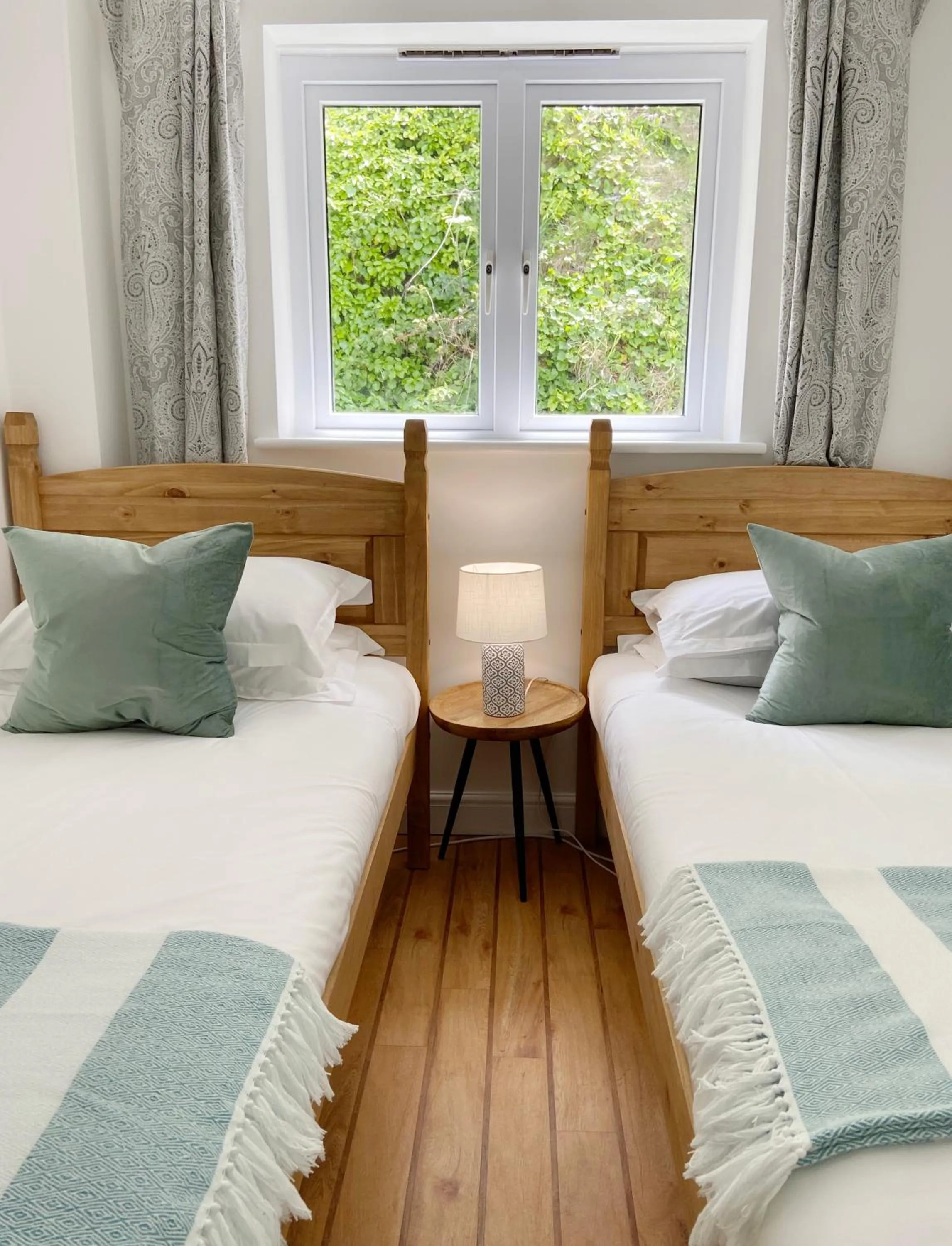 Bed in Tolcarne Beach Apartments