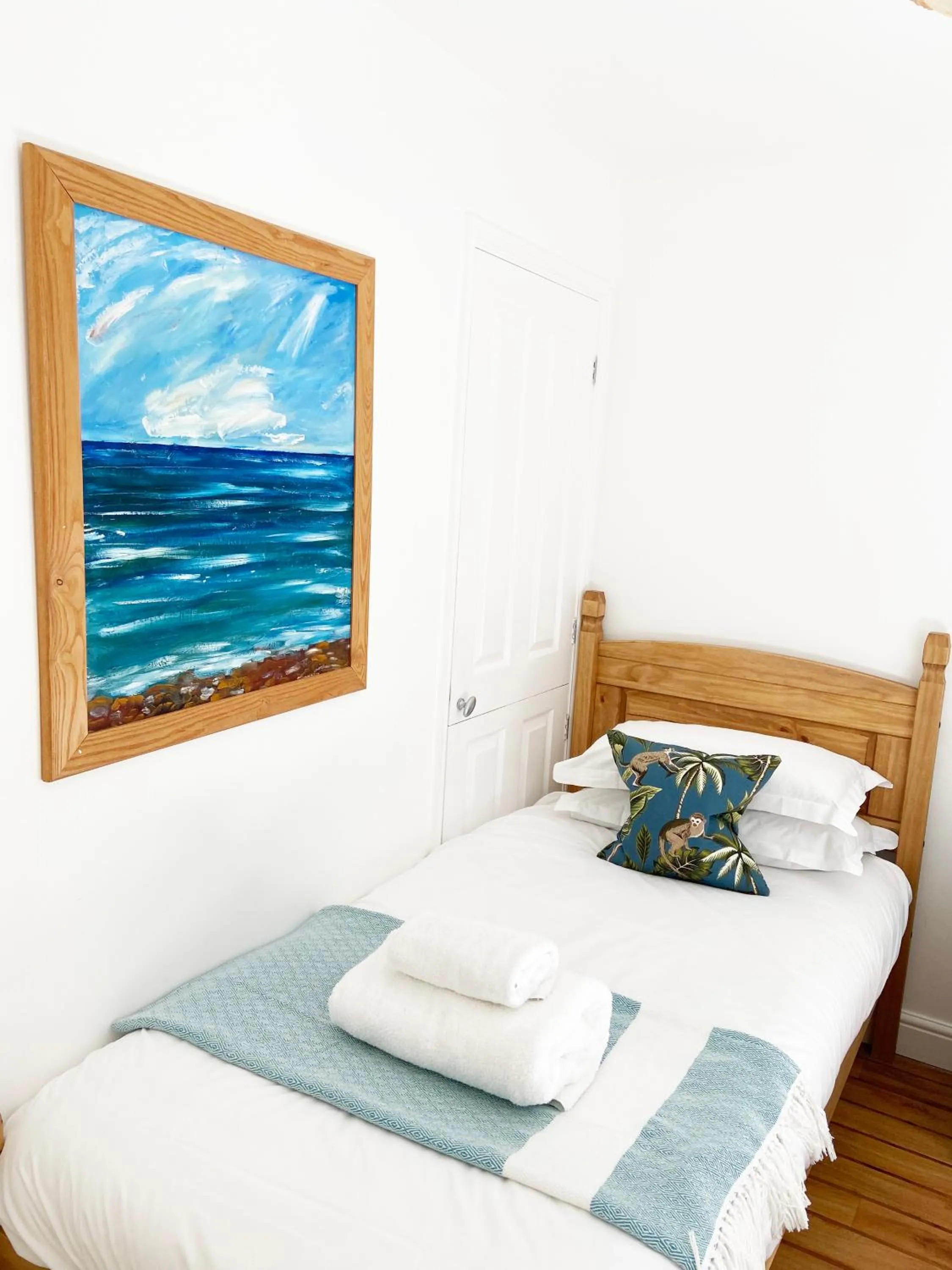 Bed in Tolcarne Beach Apartments