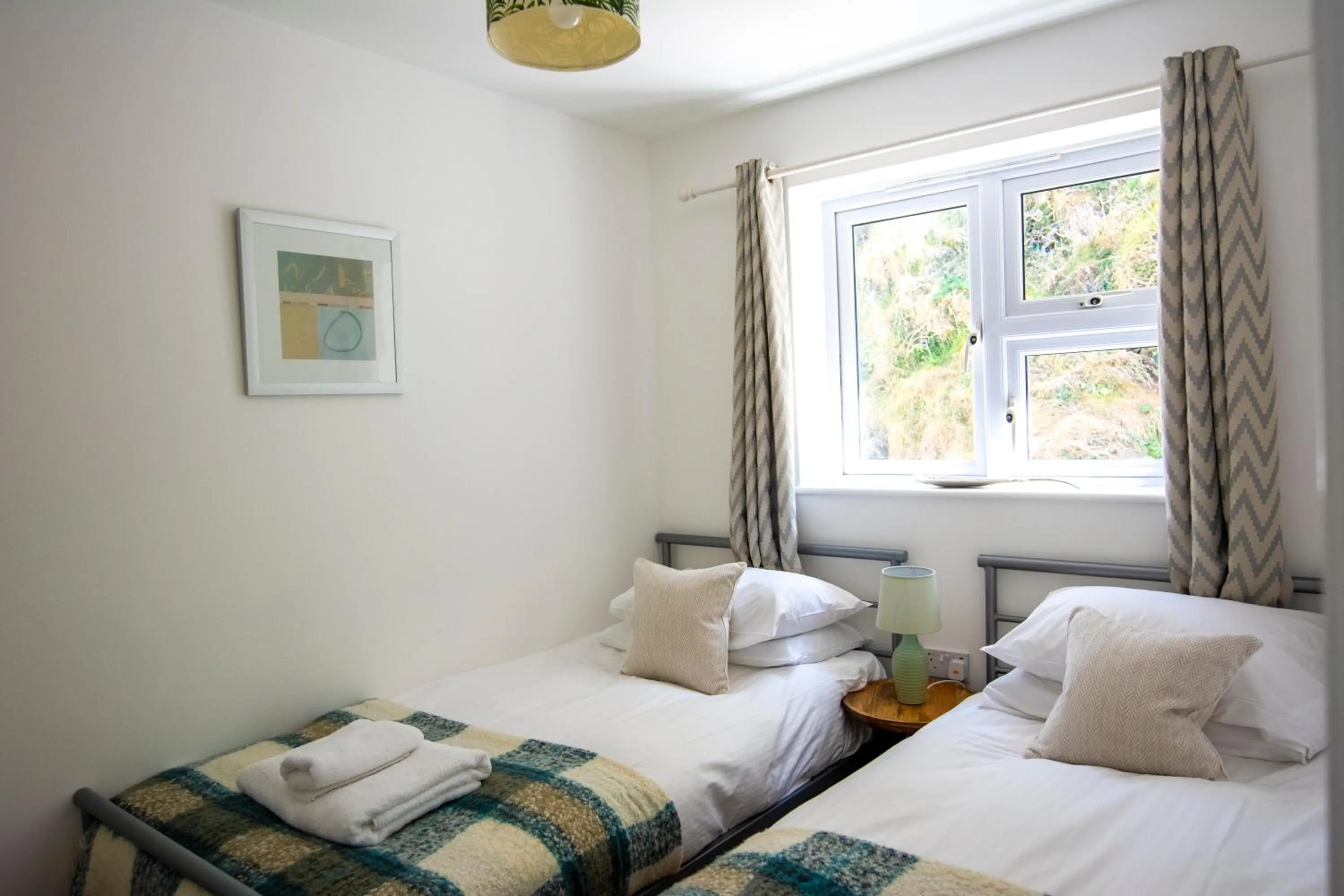 Bed in Tolcarne Beach Apartments