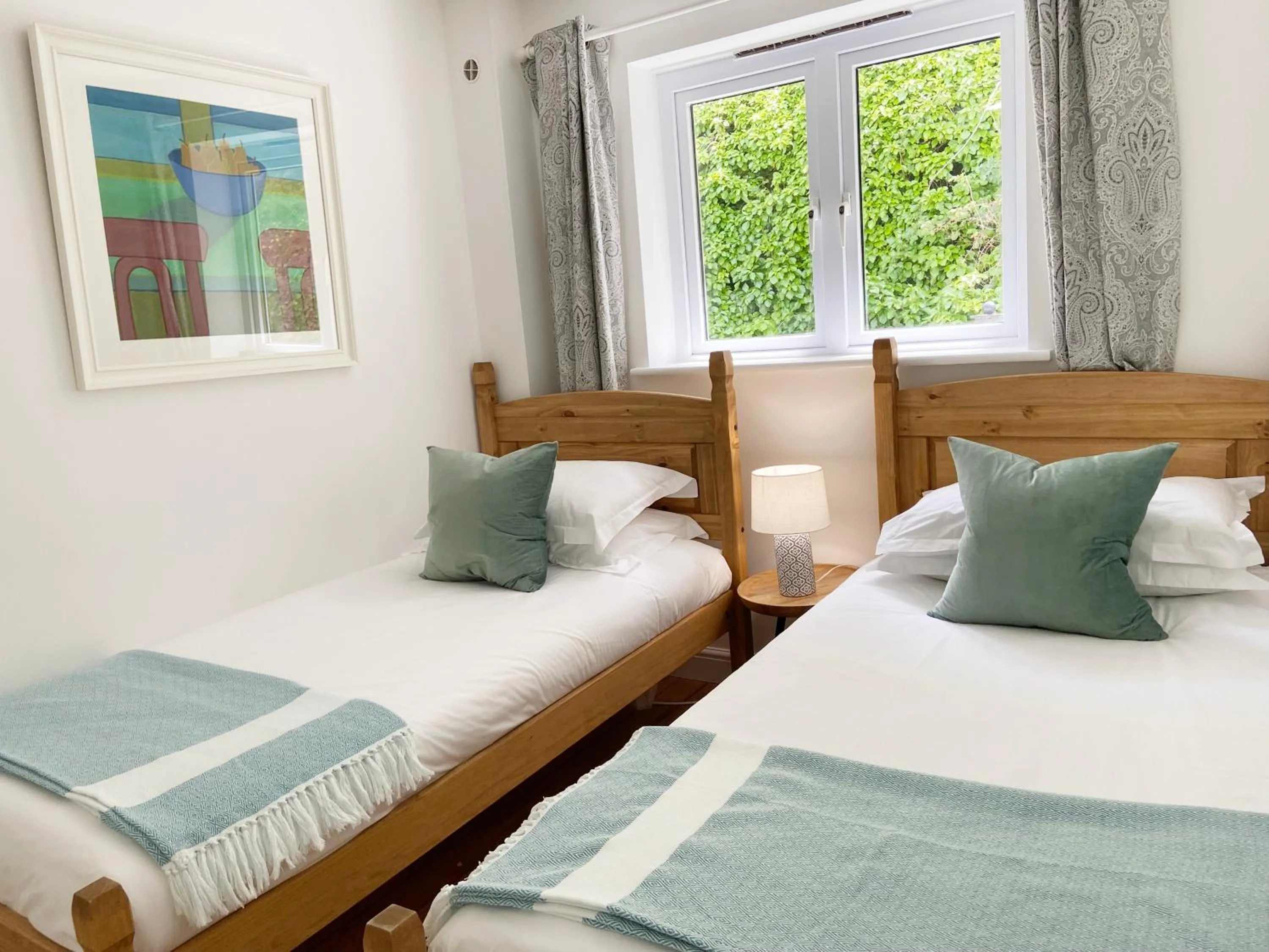 Bed in Tolcarne Beach Apartments