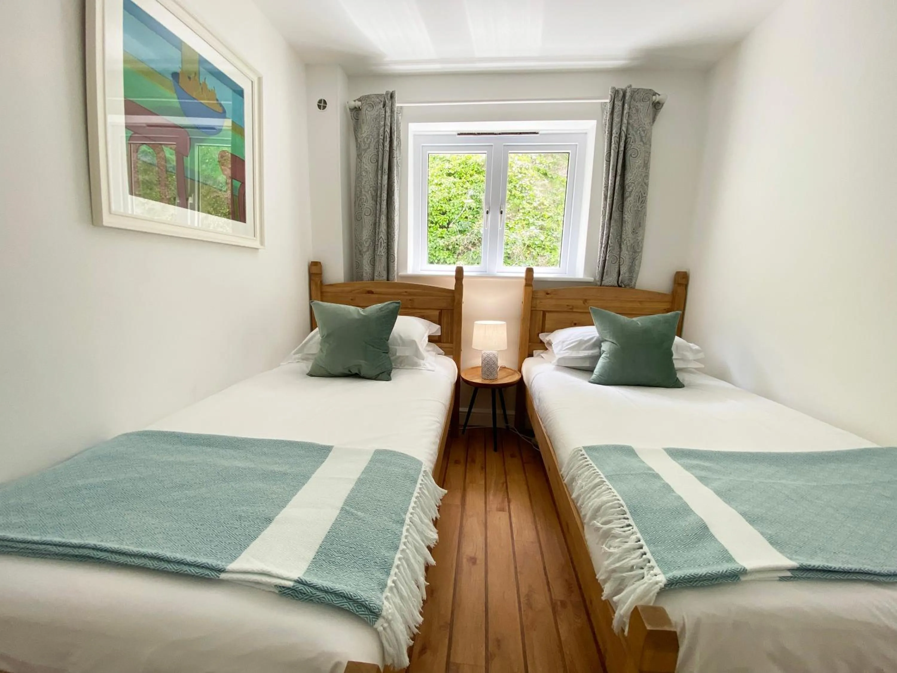 Bed in Tolcarne Beach Apartments