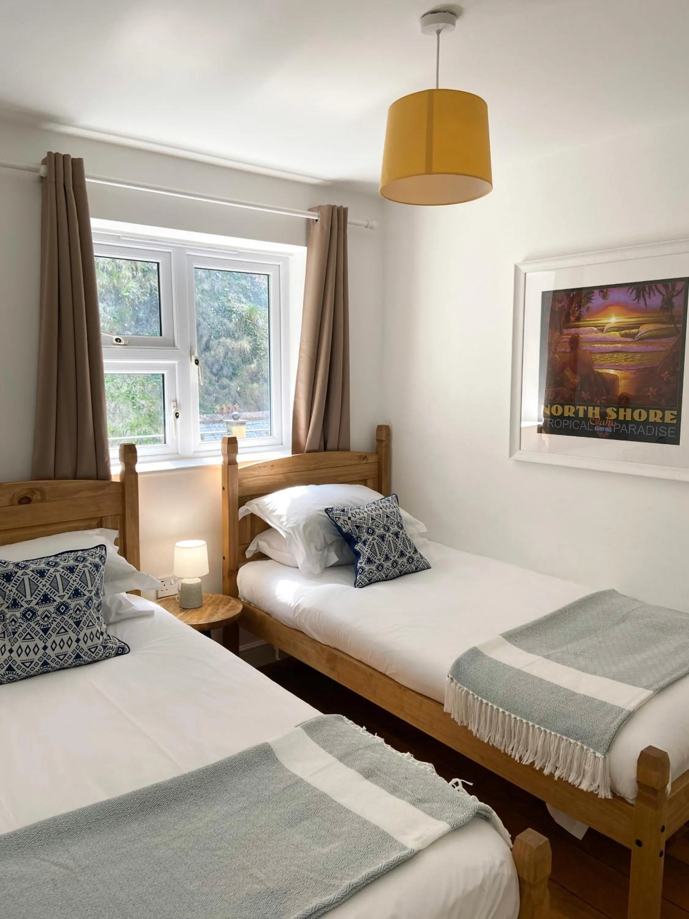 Bed in Tolcarne Beach Apartments