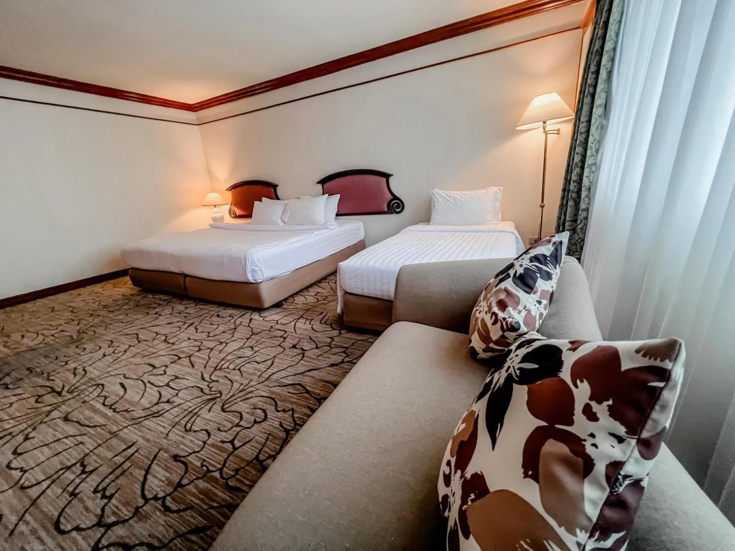 Bed in The Twin Lotus Hotel