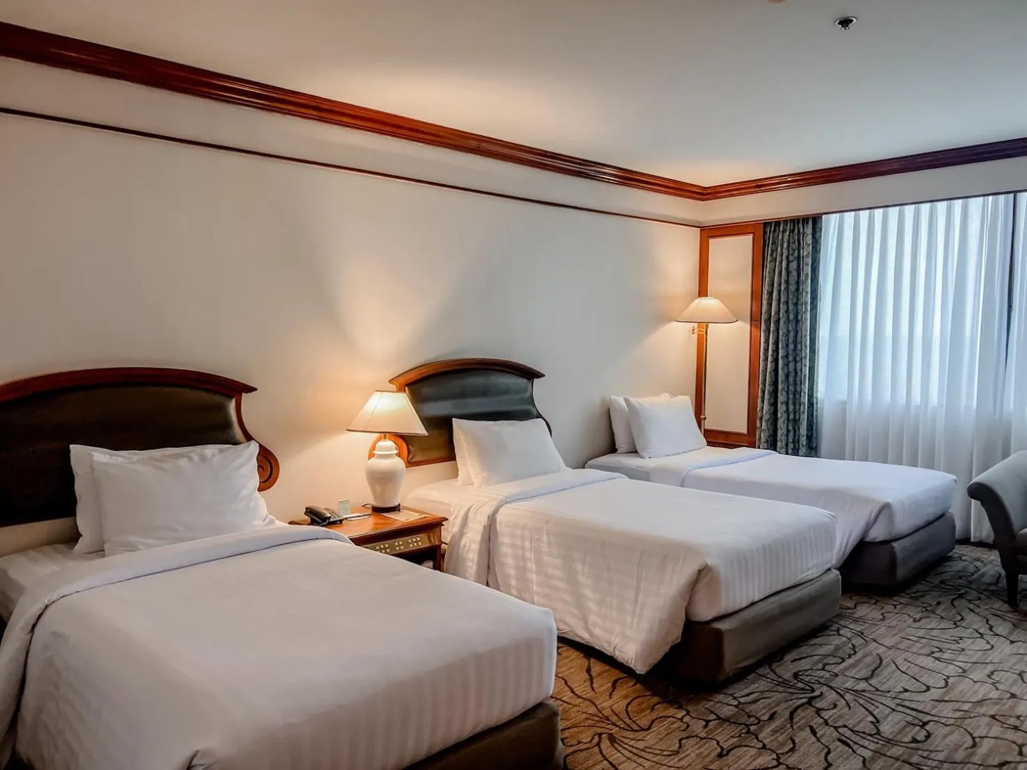 Bed in The Twin Lotus Hotel