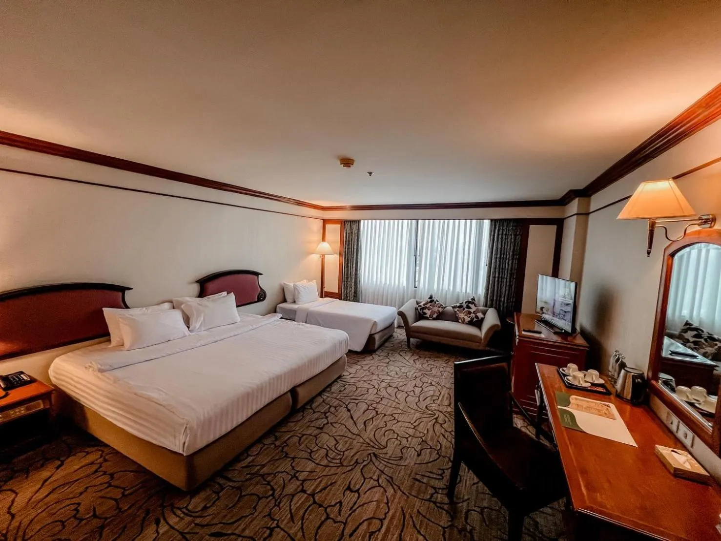 Bed in The Twin Lotus Hotel