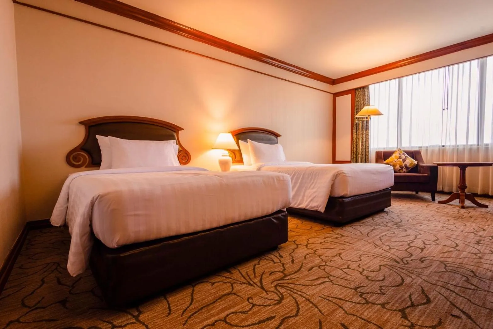 Bed in The Twin Lotus Hotel